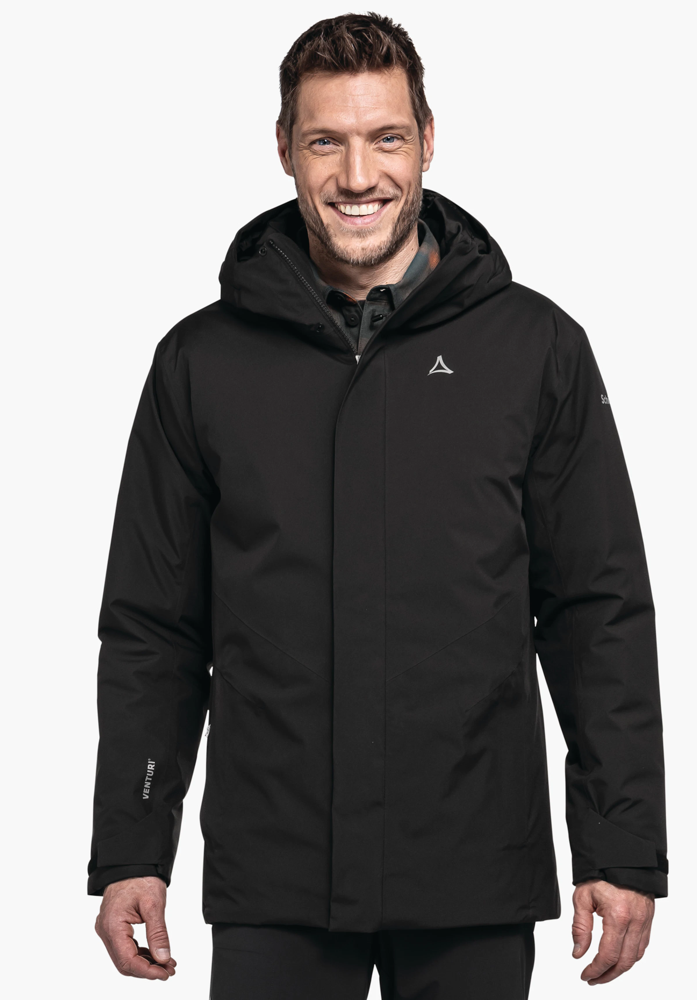 Parka Style Froda MNS Dunkelschwarze Jacke, getragen von lächelndem Mann, steht frontal; Schöffel-Logo auf Brust. Kontext: Studio, hellweißer Hintergrund. Text: "VENTURI", "Schöffel".