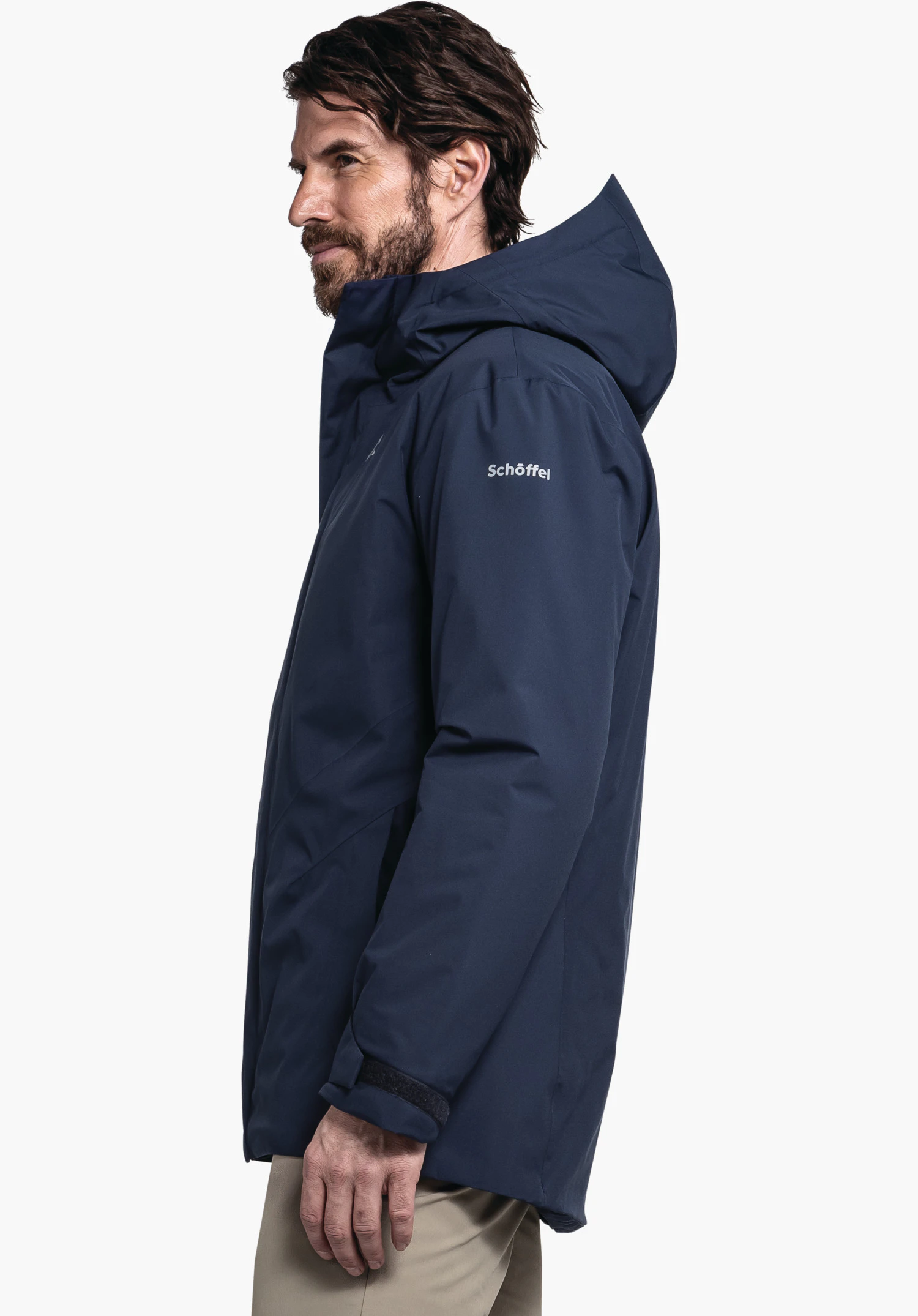 Parka Style Froda MNS in blue with Schöffel lettering, worn by a male model standing upright in a side view against a white background. (AI-generated)