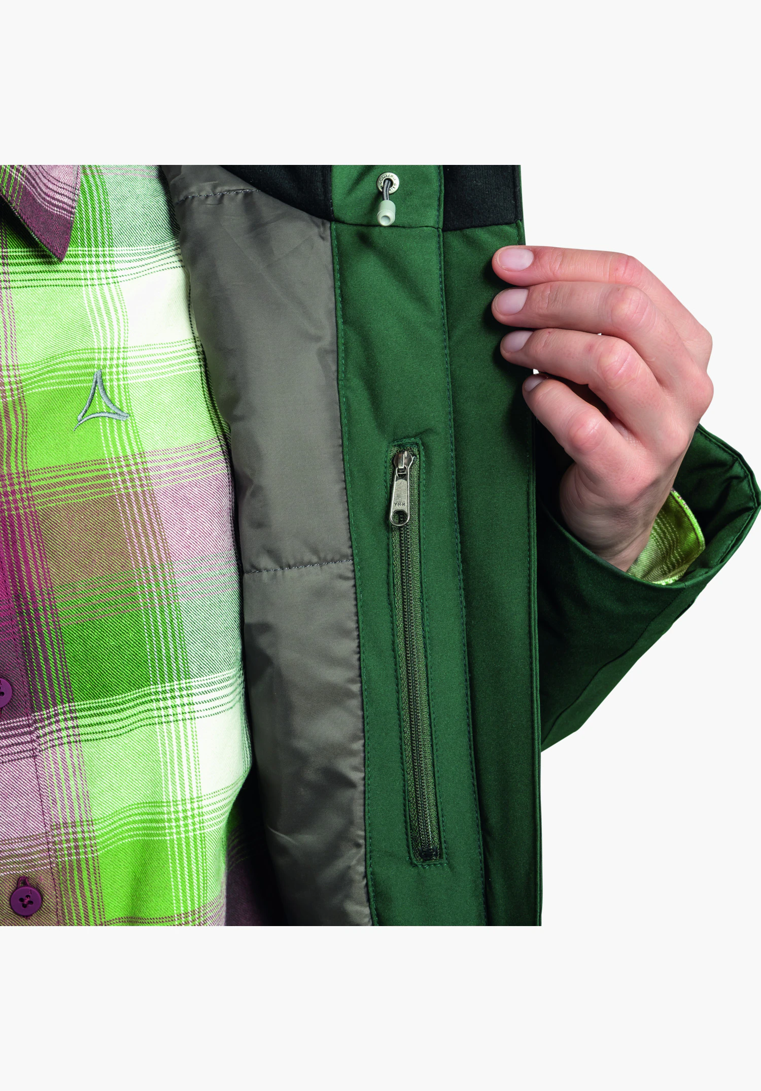 Parka Style Froda WMS, partie ouverte avec focus sur la poche intérieure verticale zippée dans la matière verte. Gros plan sur fond blanc/neutre.
