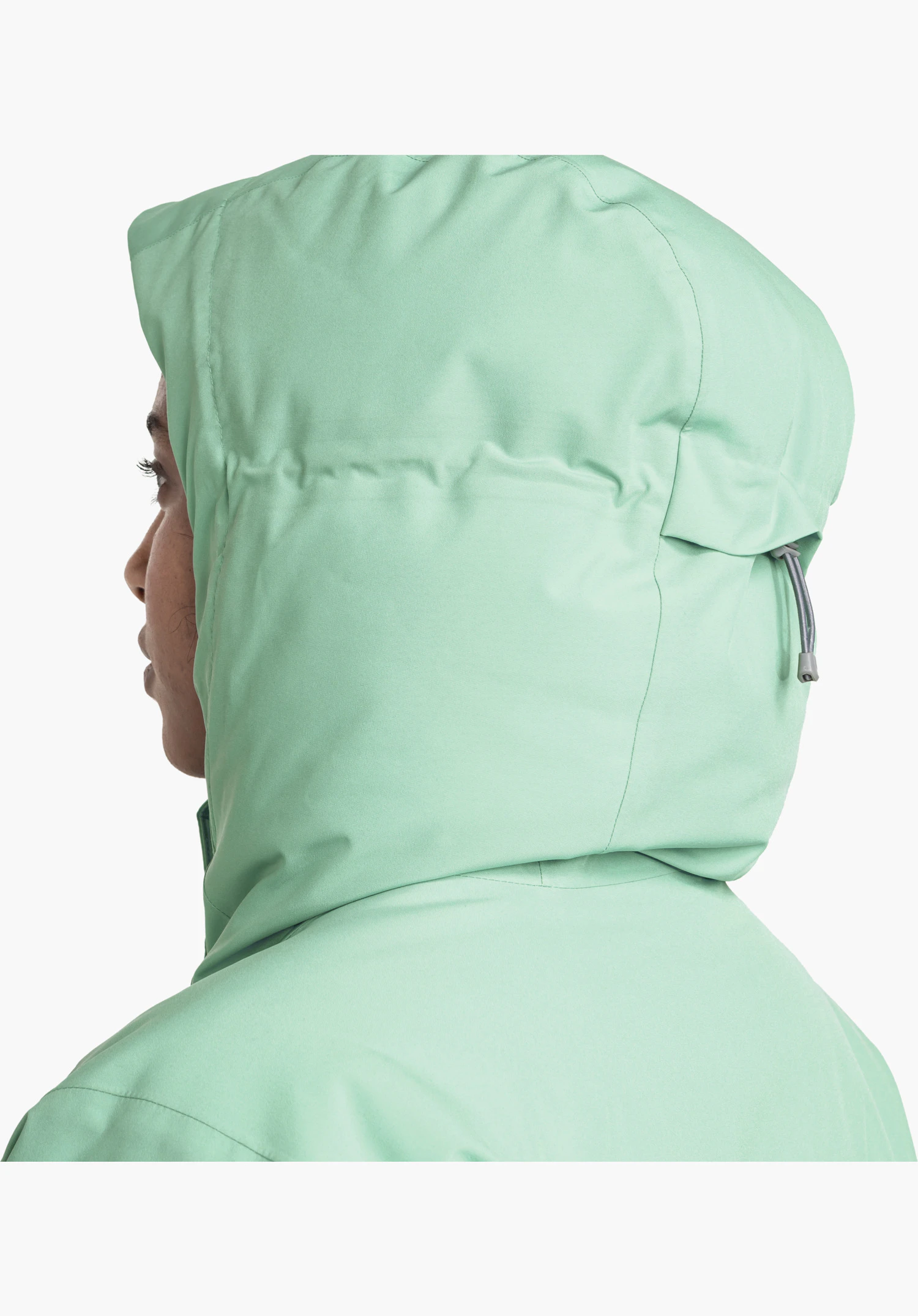 Parka Style Froda WMS montre la vue arrière de la capuche verte avec un focus sur le cordon de serrage réglable à l'arrière de la tête, gros plan sur fond blanc.