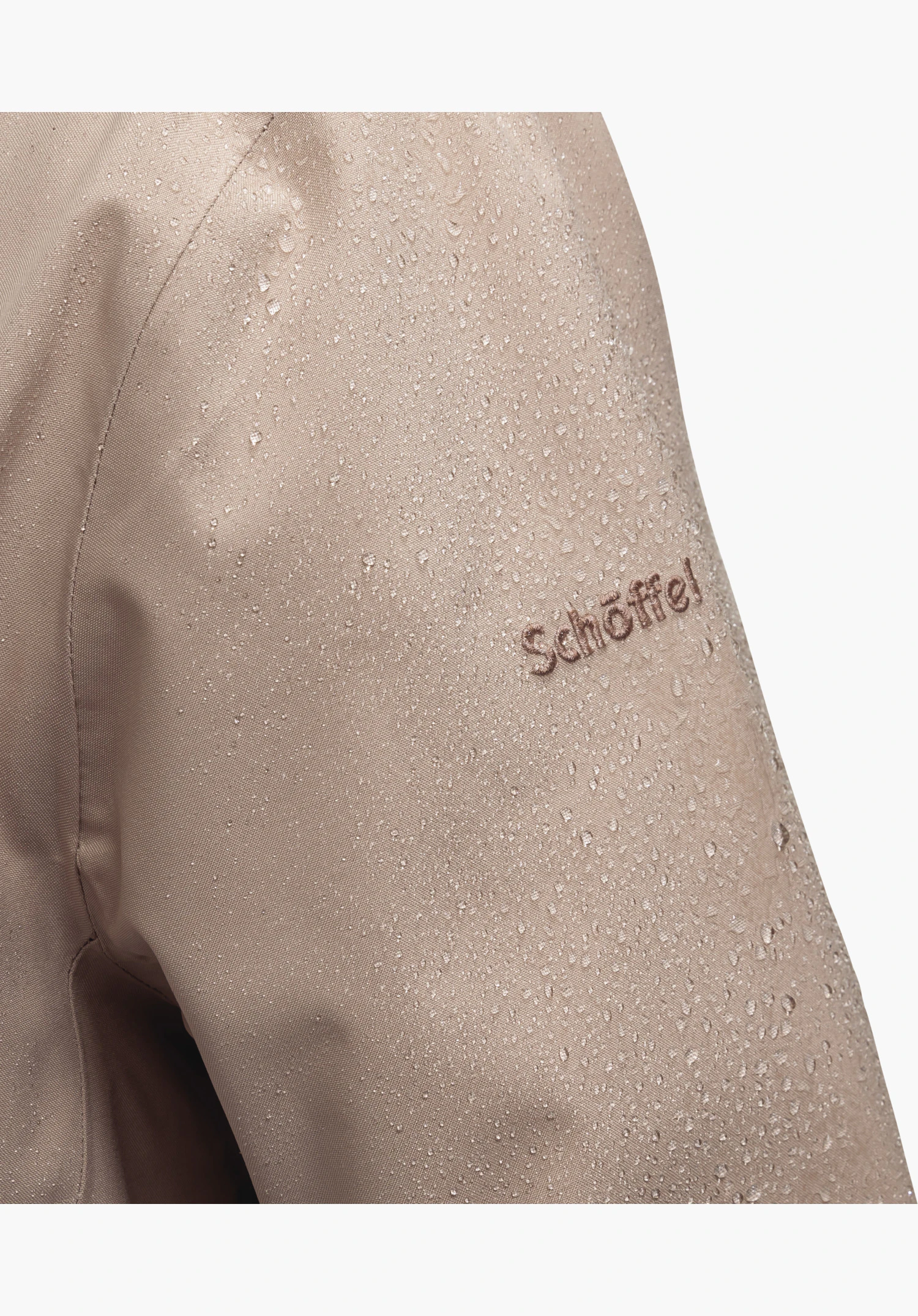 Ins Parka Style Crivat WMS in pink showing water droplets beading off the material and an embroidered Schöffel logo, close-up shot against a white background.