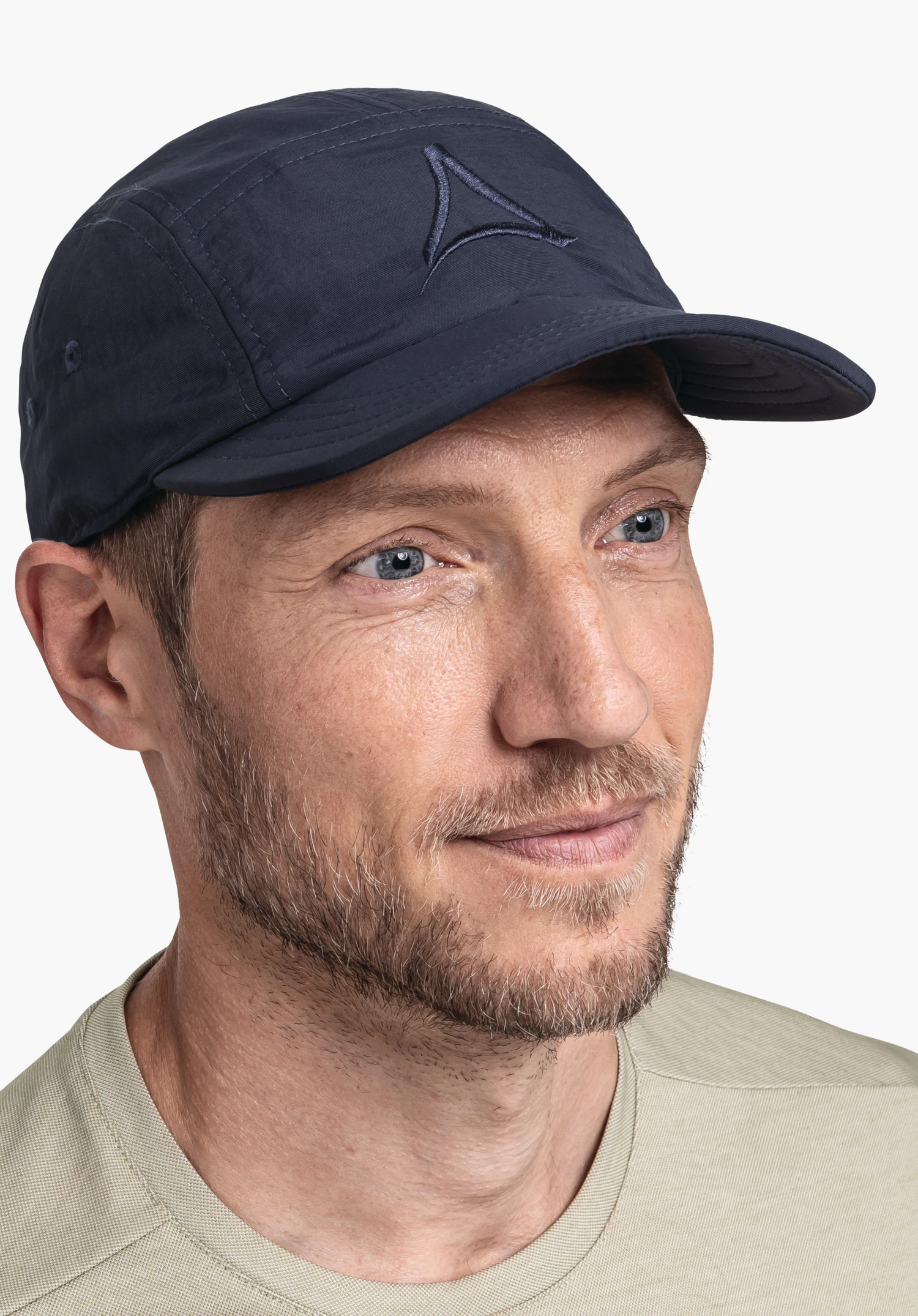 Sun Cap in blue: The model is seen in a semi-profile view, showcasing the subtle Schöffel logo on the front. A neutral background highlights the clean design, perfect for outdoor activities.
