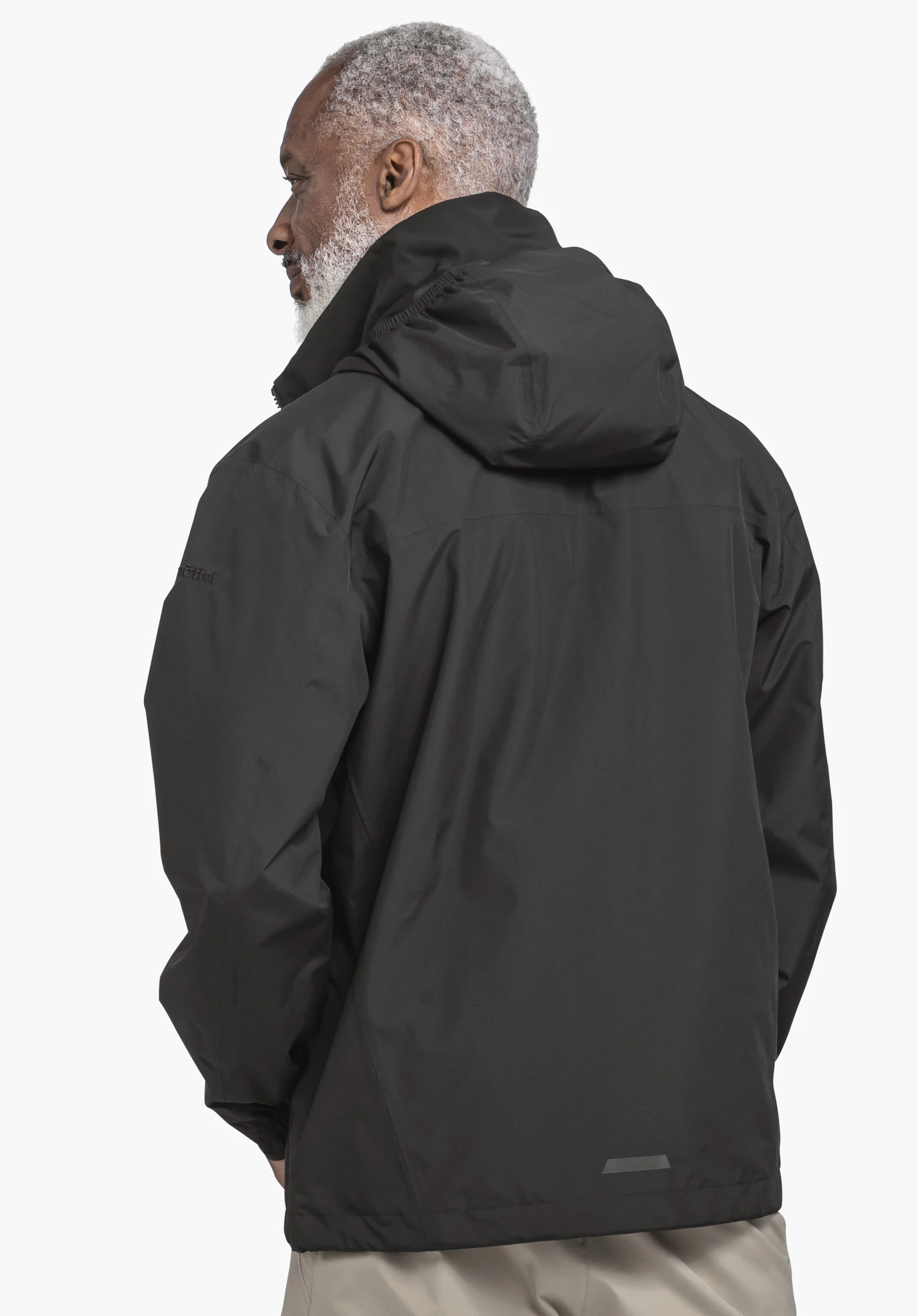 Jacket Style Bohorok MNS in schwarz, präsentiert in der Rückenansicht an einem Model vor neutralem Hintergrund mit sichtbarem Schöffel-Logo am Ärmel.