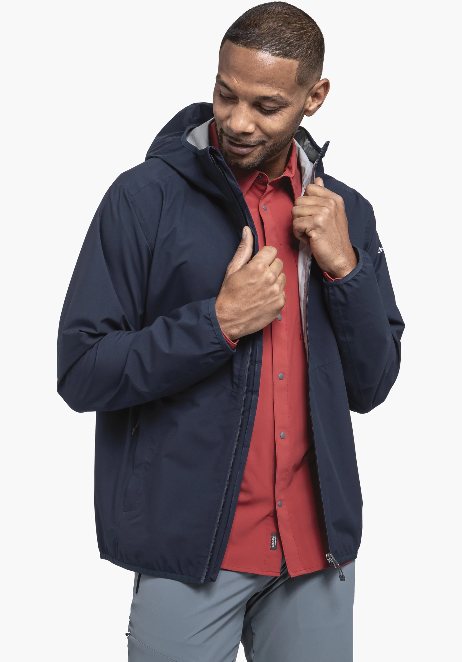 Jacket Style Migandi MNS displays the zip and collar area with grey lining standing out against the blue material, close-up against a white/neutral background.