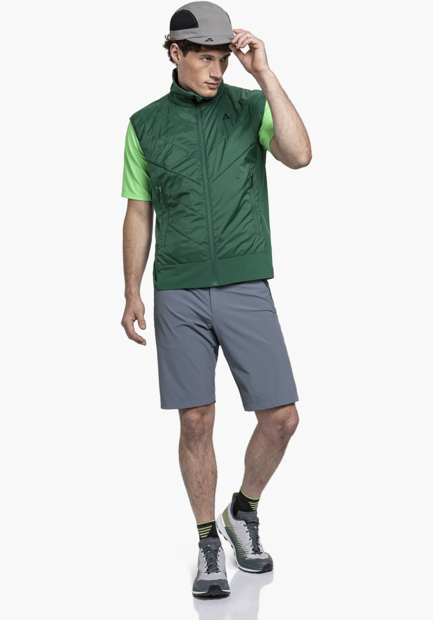 Hybrid Vt Style Blaueis MNS, the subtle Schöffel logo on the quilted green fabric in the chest area, close-up shot against a white/neutral background.