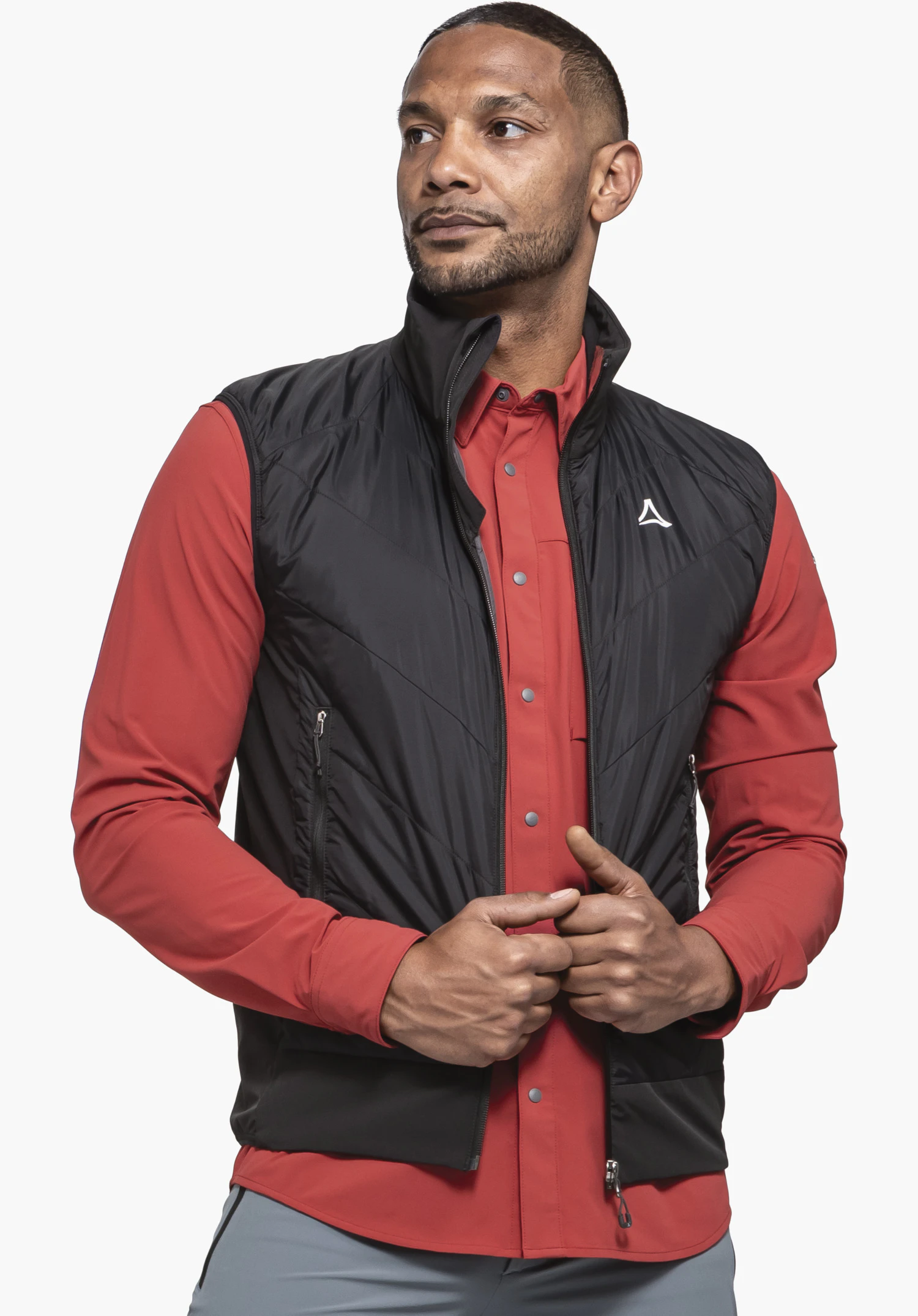 Hybrid Vt Style Blaueis MNS shows the prominent Schöffel logo on the black, V-shaped quilted chest section, close-up against a neutral background.