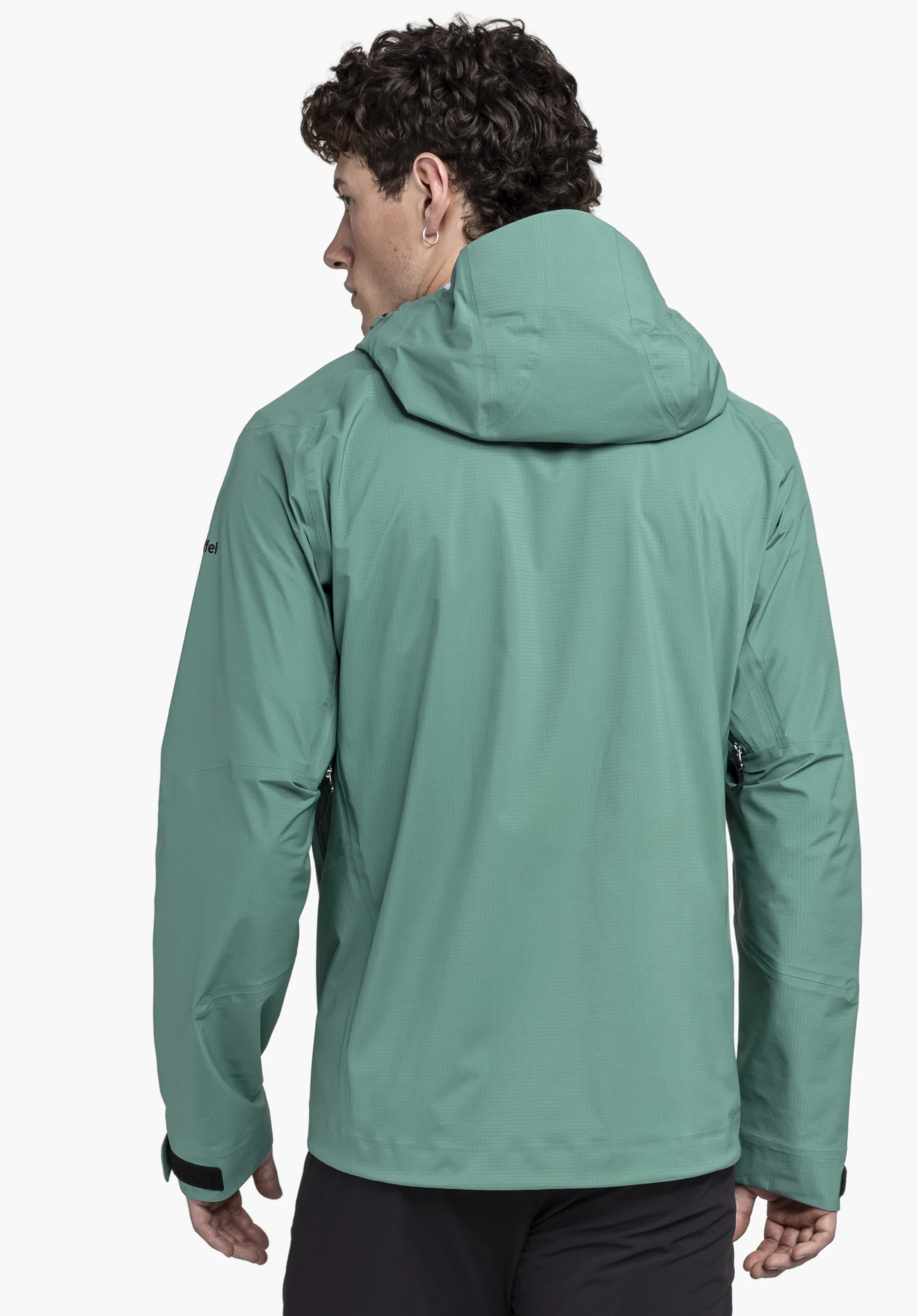 Jacket Style Blaueis MNS in green shown from the back on a model against a neutral background, with the Schöffel logo visible on the sleeve.