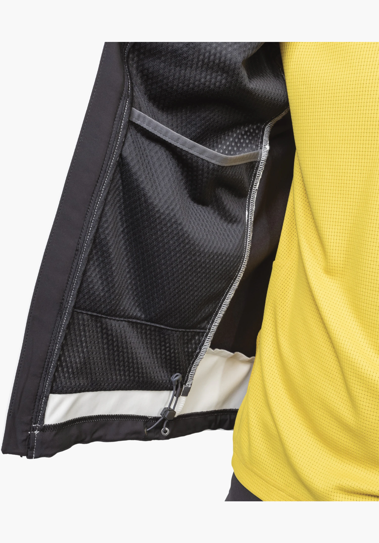 Softshell Jk Style Blaueis MNS, detail of the opened interior showing the breathable mesh lining, an open inner pocket, and the adjustable hem drawcord over a light fabric insert in the colour natur, close-up shot against a white/neutral background.