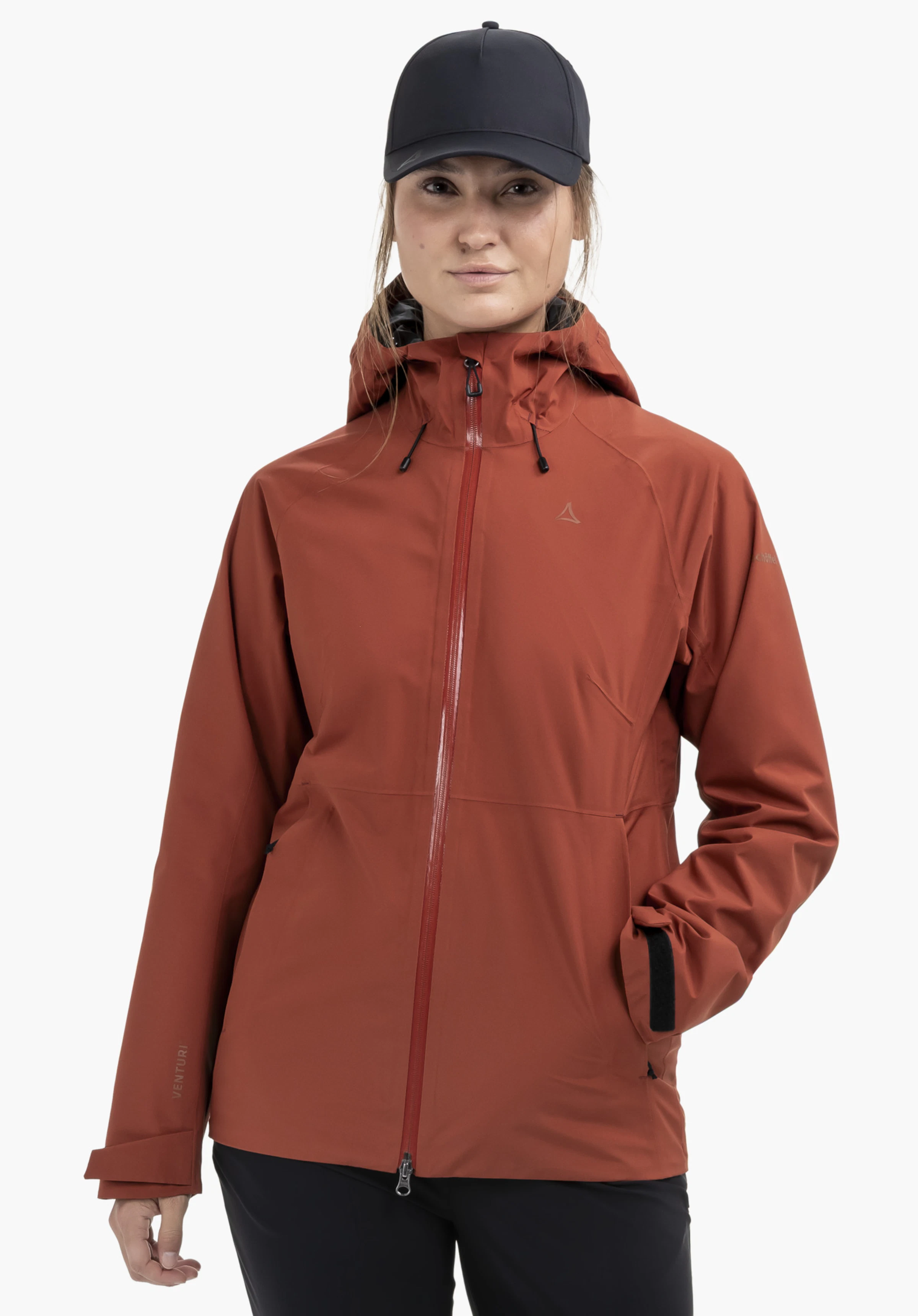 Jacket Style Mauku WMS in red, worn by a model standing facing forwards with one hand in the pocket. The Schöffel logo is clearly visible on the left chest, presented against a neutral background.