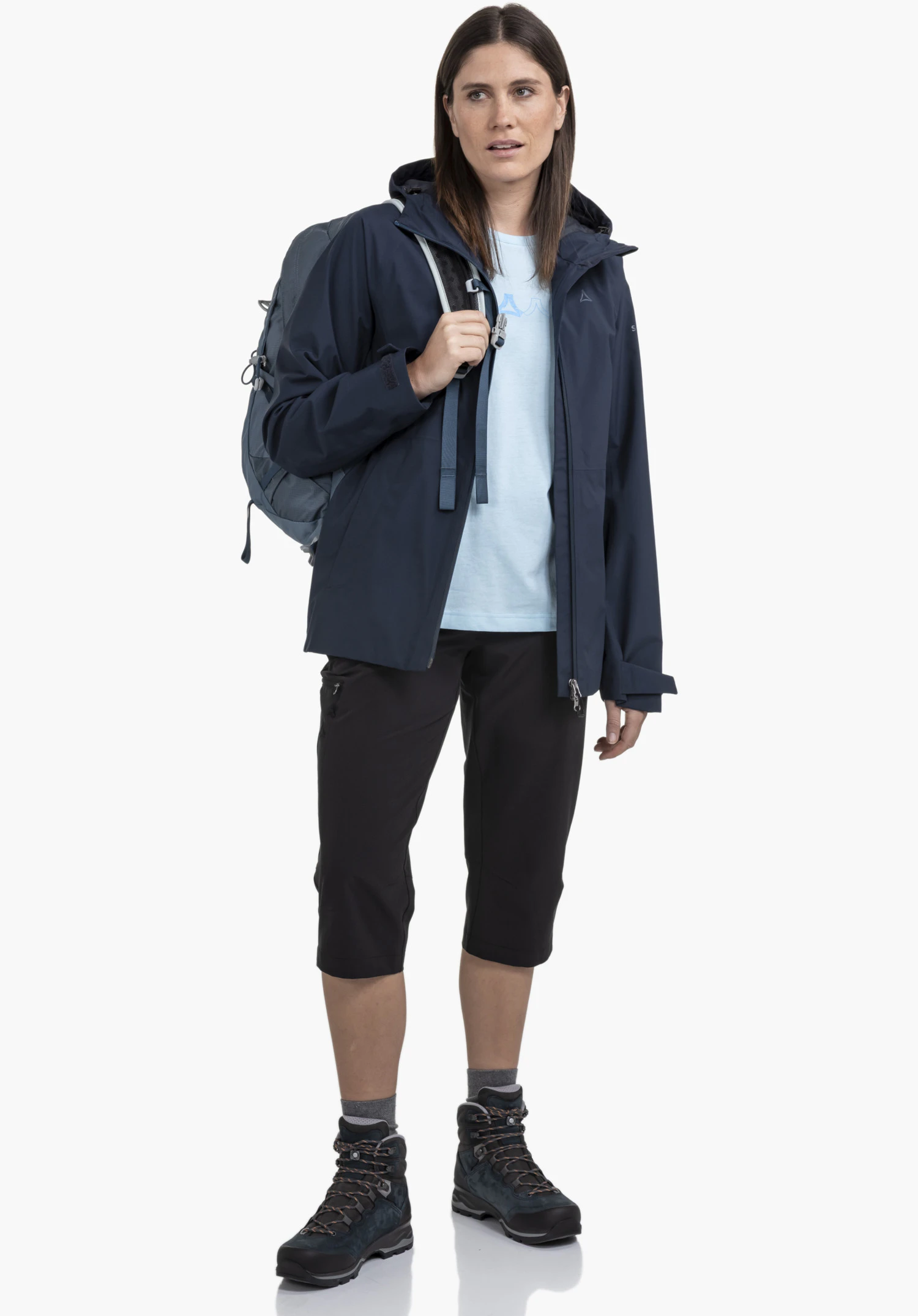 Jacket Style Mauku WMS shows the subtle Schöffel logo on the blue fabric next to the front zip, close-up against a white/neutral background.