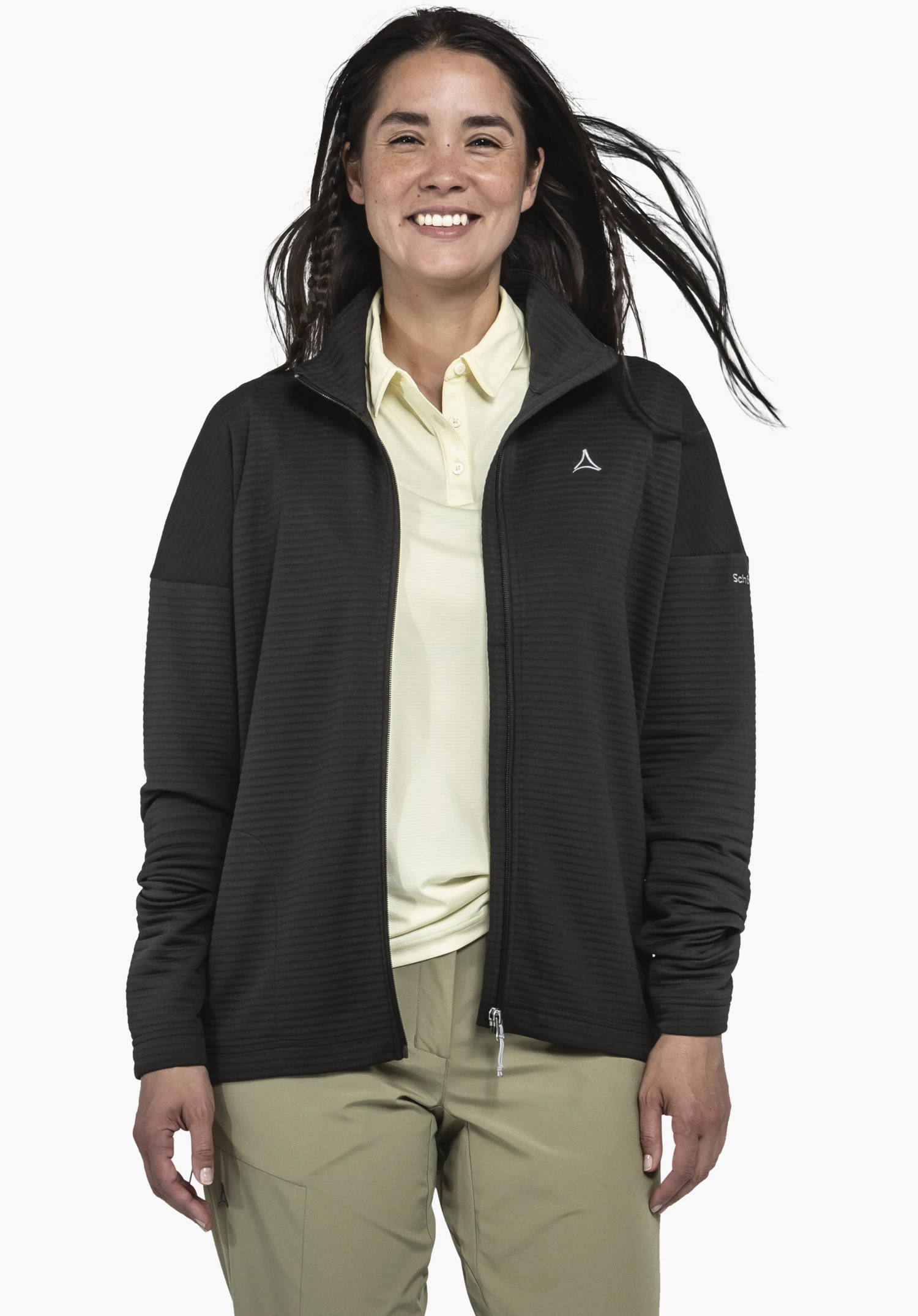 CIRC Fleece Jk Style Smue WMS, focus on the black fleece fabric with a fine horizontal ribbed texture and the white Schöffel logo on the chest, close-up against a white background.