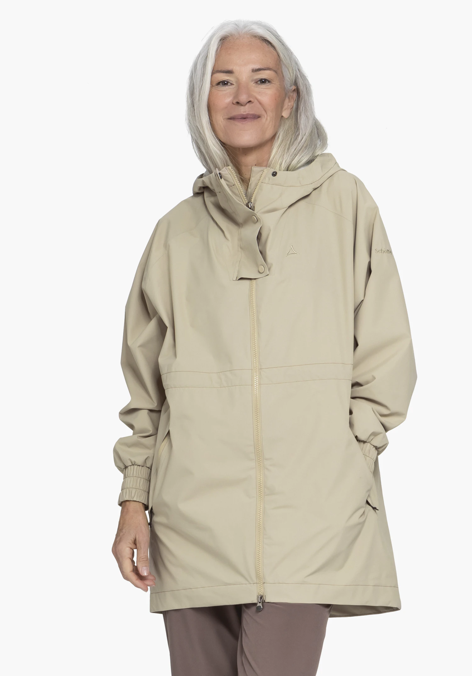 Parka Style Bohorok WMS in beige, presented in a front view by a model against a neutral background. The subtle Schöffel logo is visible on the chest, adding to the clean design of the parka.
