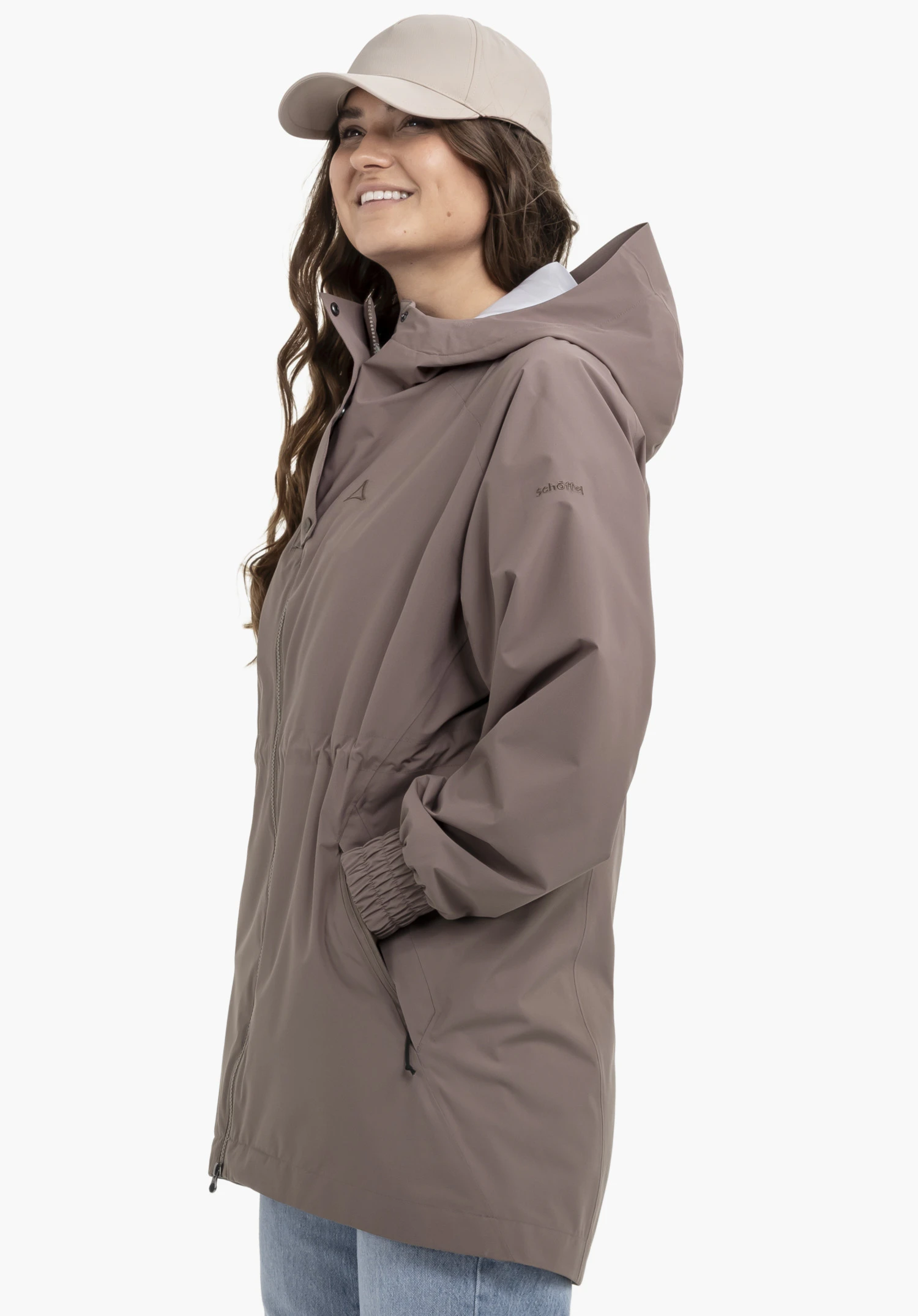 Parka Style Bohorok WMS in brown, worn by a model against a neutral background. The shot captures the model from the side, showcasing the subtle Schöffel logo on the upper arm.