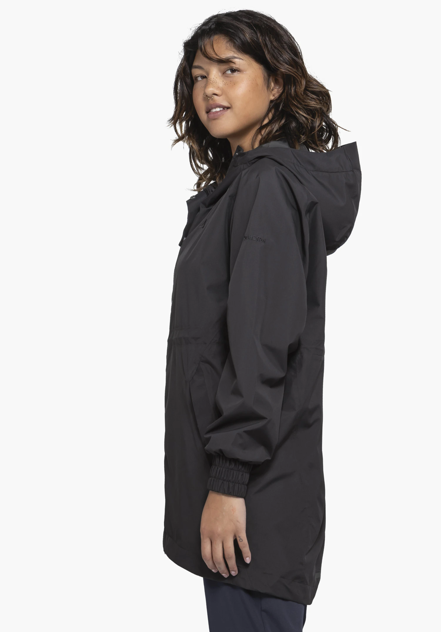 Parka Style Bohorok WMS in black shown on a model standing in profile. The parka is presented against a neutral background, highlighting the subtle Schöffel logo on the upper arm.