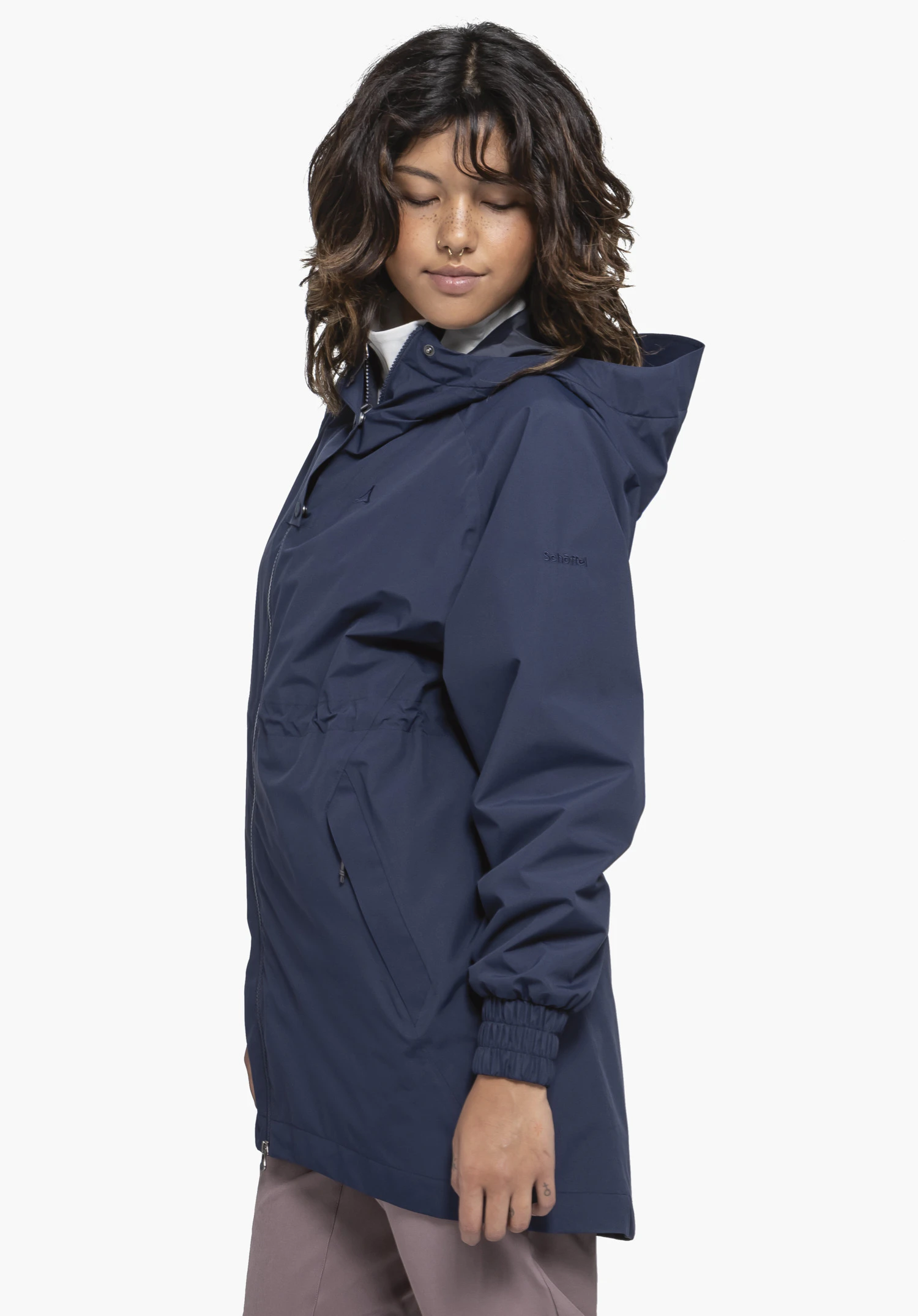 Parka Style Bohorok WMS in blue. A model stands sideways wearing the jacket against a neutral background, with the Schöffel logo visible on the sleeve.