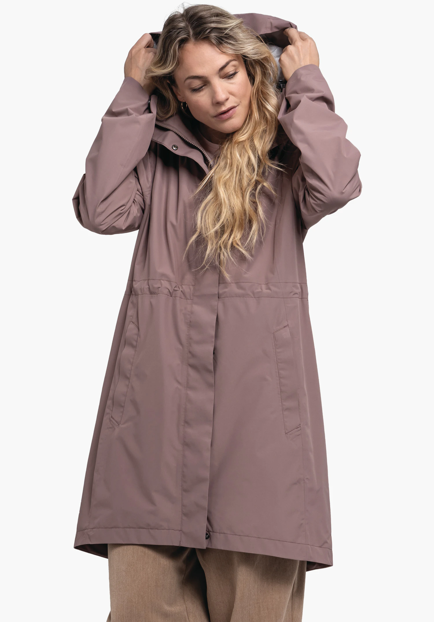 Coat Style Bohorok WMS, view of the smooth, brown fabric texture and the metallic press stud at the collar of the concealed placket, close-up against a white background.
