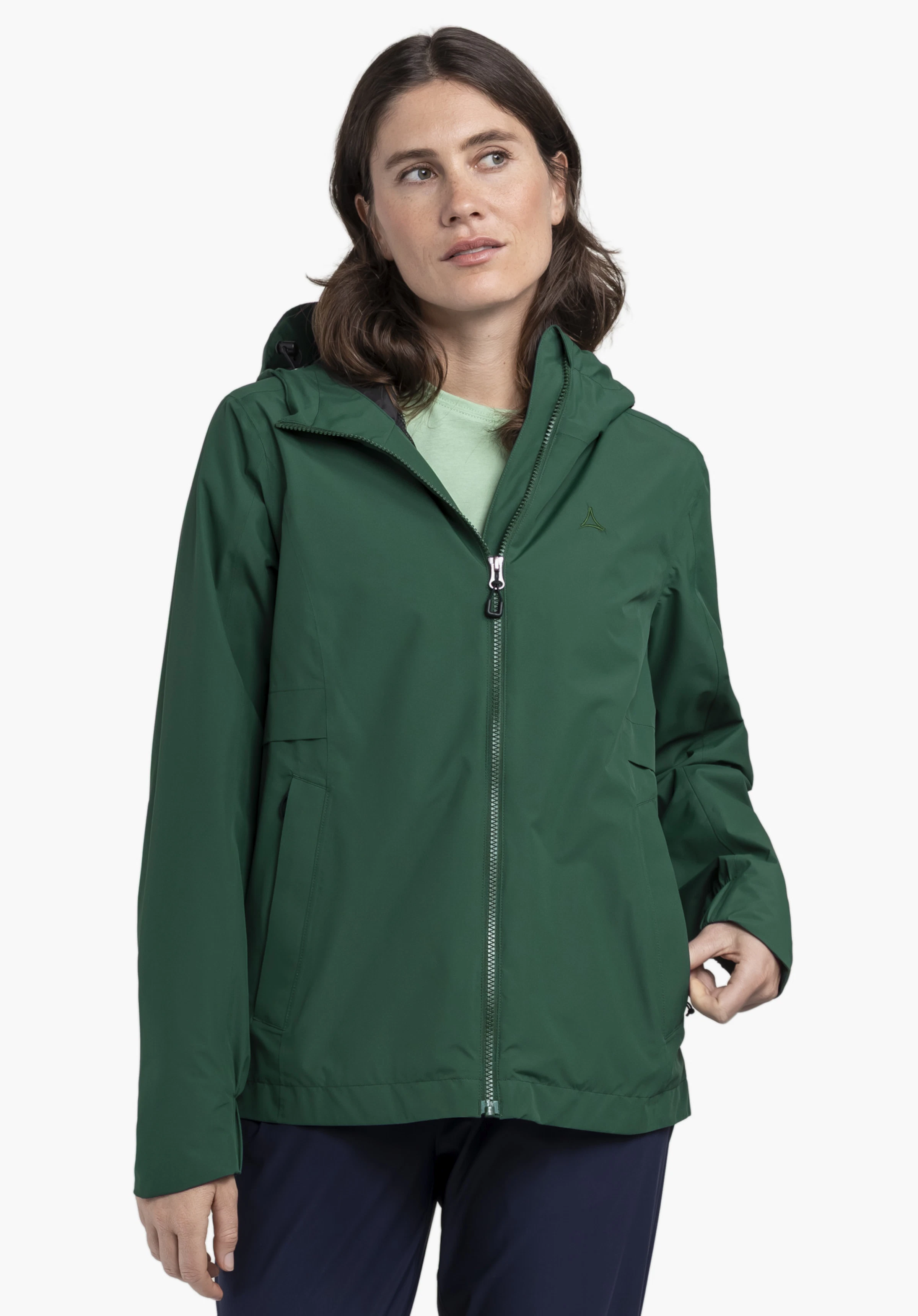 Jacket Style Bohorok WMS in green worn by a female model in a frontal pose against a neutral background. The jacket features a clean silhouette with the subtle Schöffel logo visible on the chest.