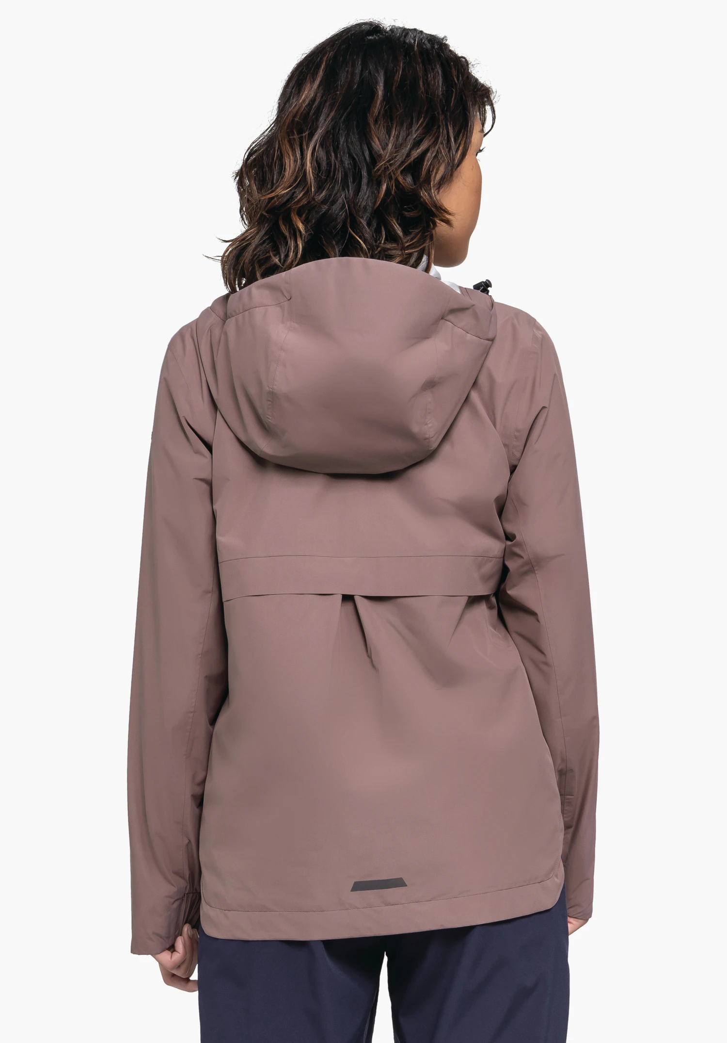 Jacket Style Bohorok WMS. The model stands in a back view, presenting the brown hooded jacket against a neutral background.