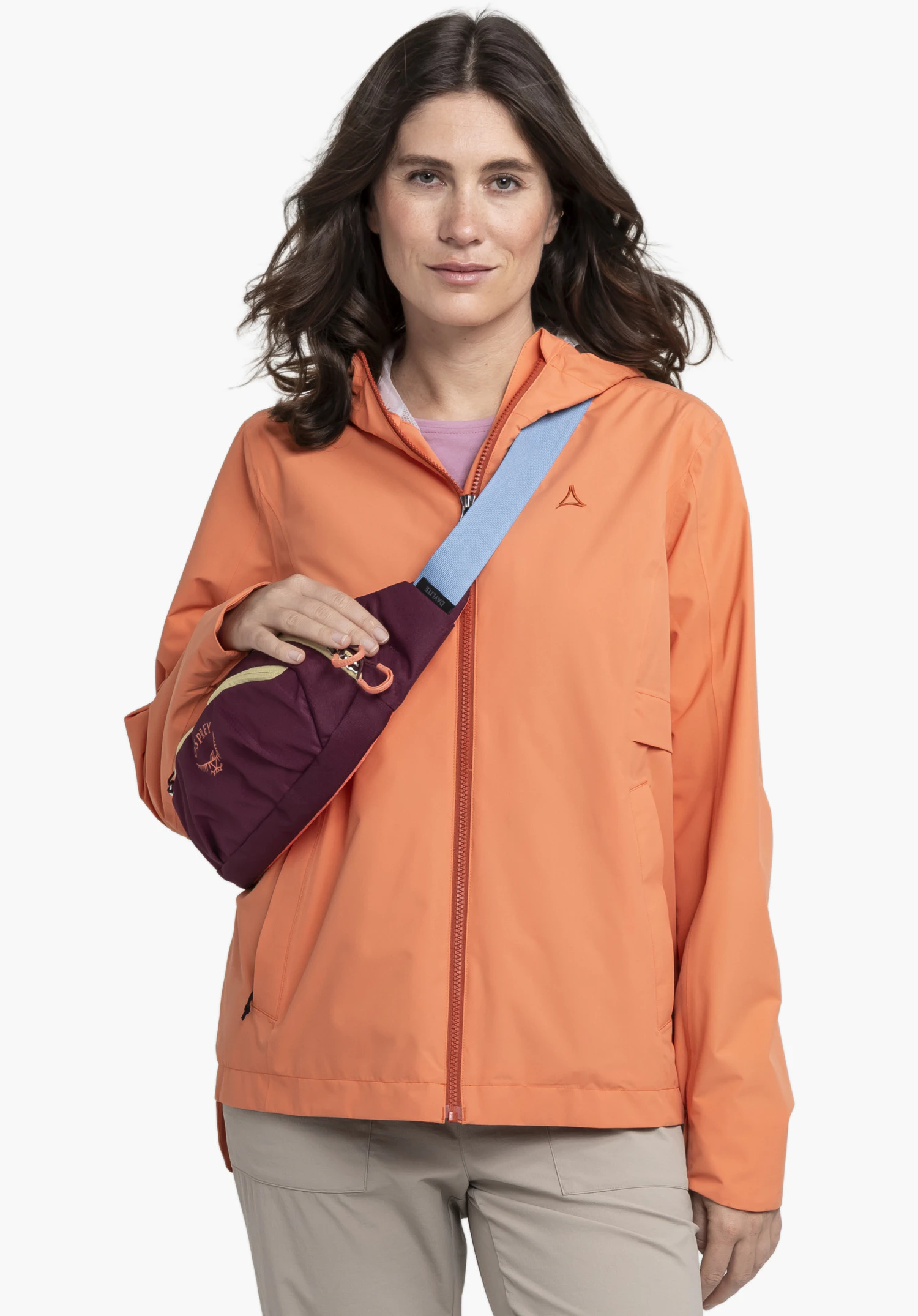 Jacket Style Bohorok WMS focusing on the Schöffel logo on the chest and the front zip on the orange fabric, close-up against a white/neutral background.