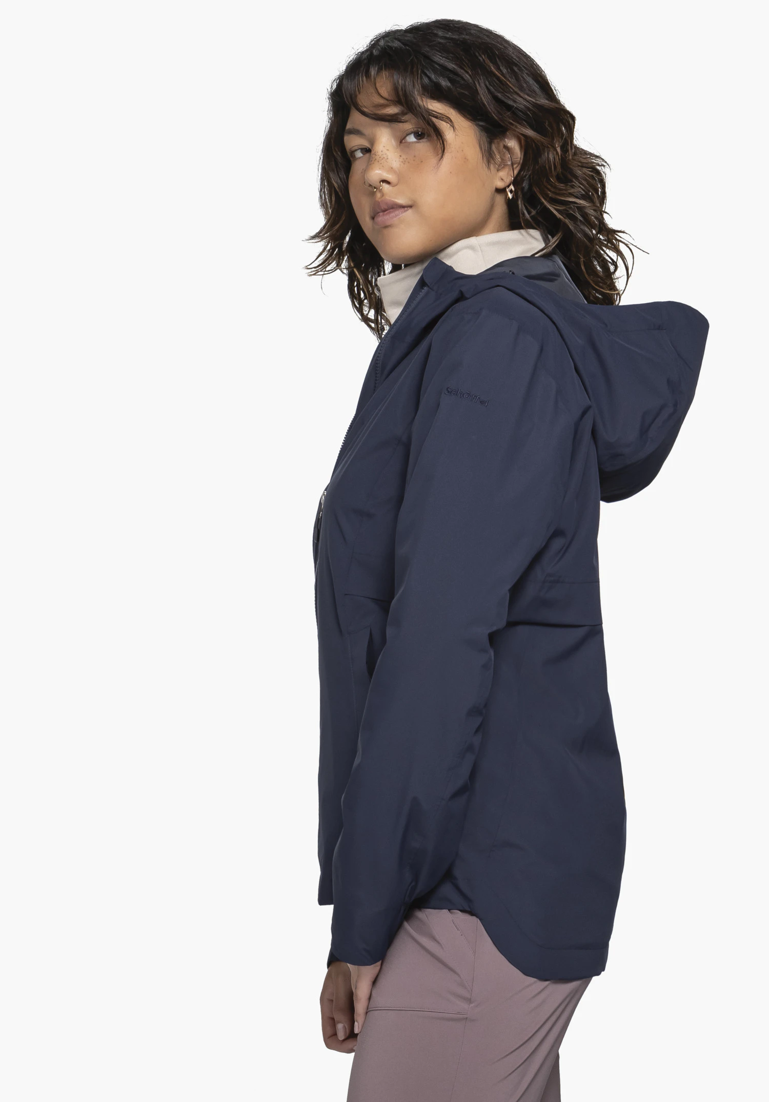 Jacket Style Bohorok WMS in blue, showcased by a model in a side profile view. The subtle Schöffel logo on the upper arm is clearly visible, with the jacket presented against a neutral background.