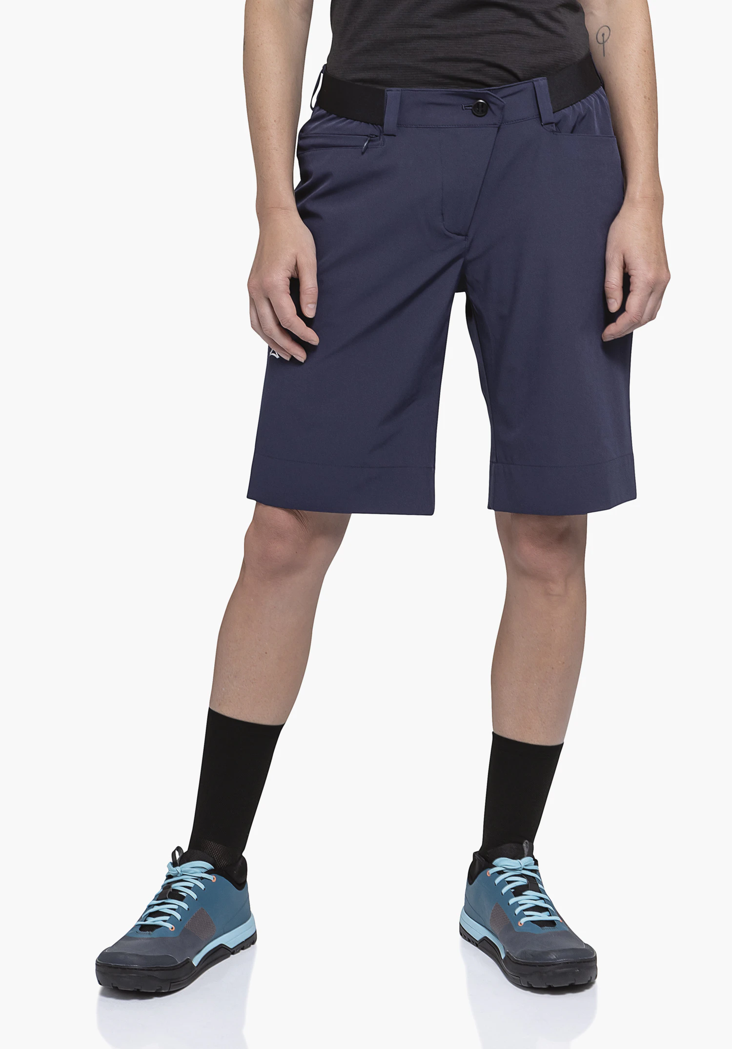 Shorts Style Keitele WMS, worn by a model standing in a front view. You can see the blue shorts with the partially visible Schöffel logo on the right leg against a neutral background.