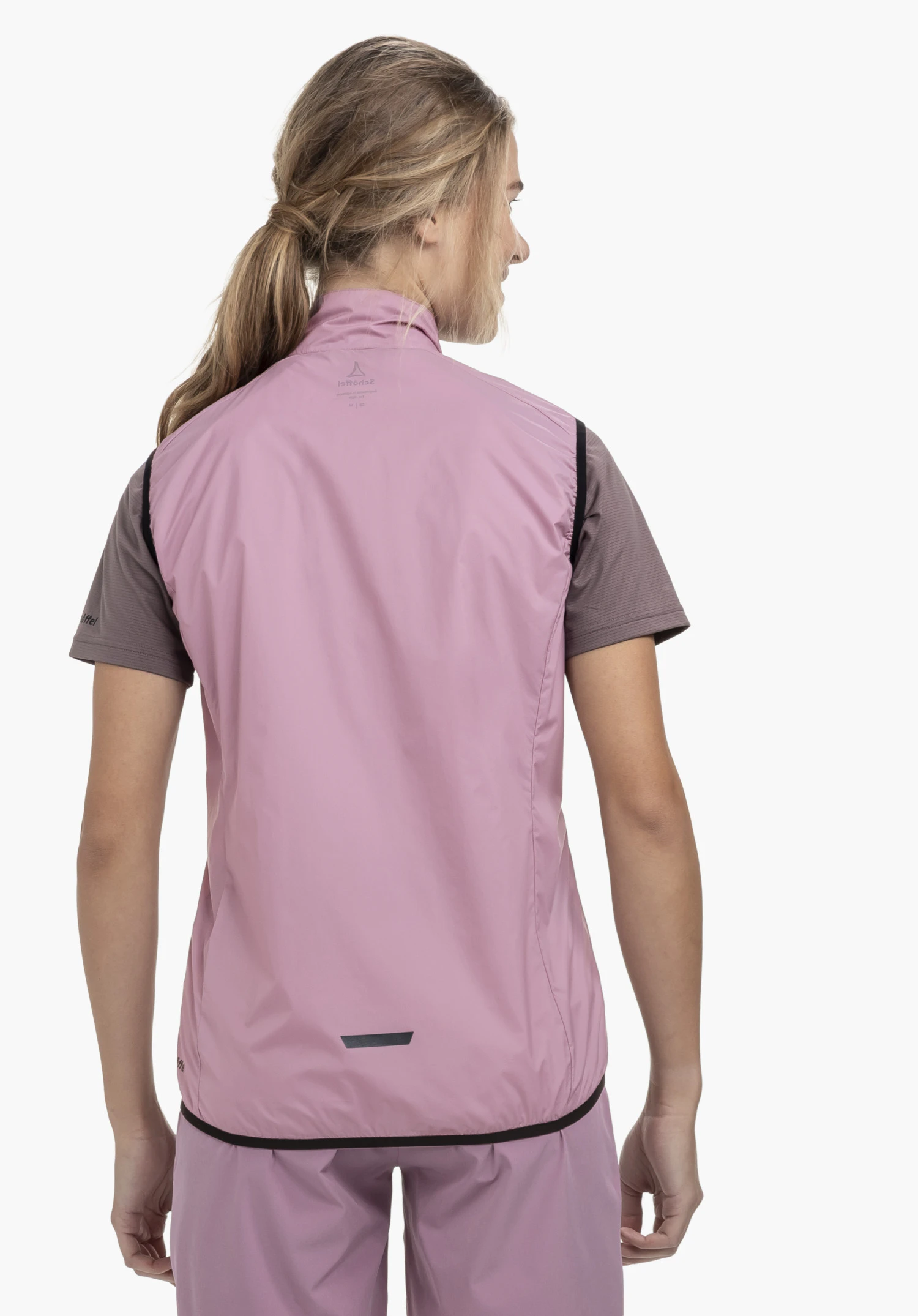 Vest Style Cannobio WMS in rosa, shown in a rear view on a model against a neutral background, with the Schöffel-Logo visible on the back of the neck.