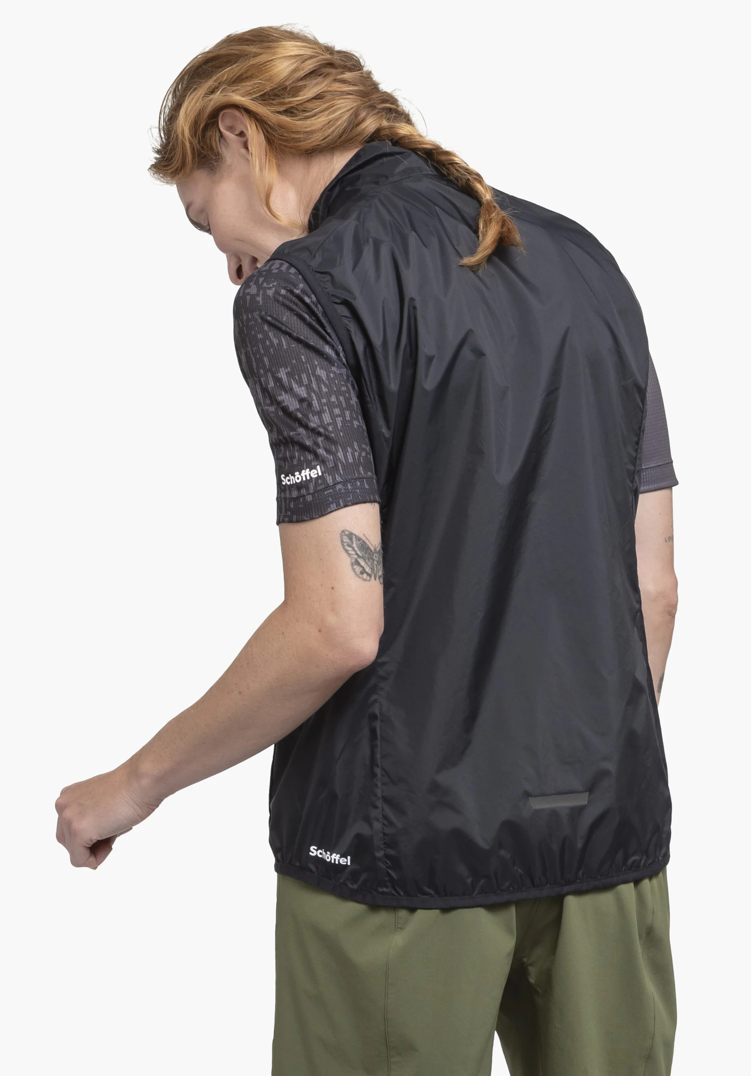 Vest Style Cannobio WMS in black shown from the back on a model against a neutral background, with the Schöffel logo visible at the bottom hem.