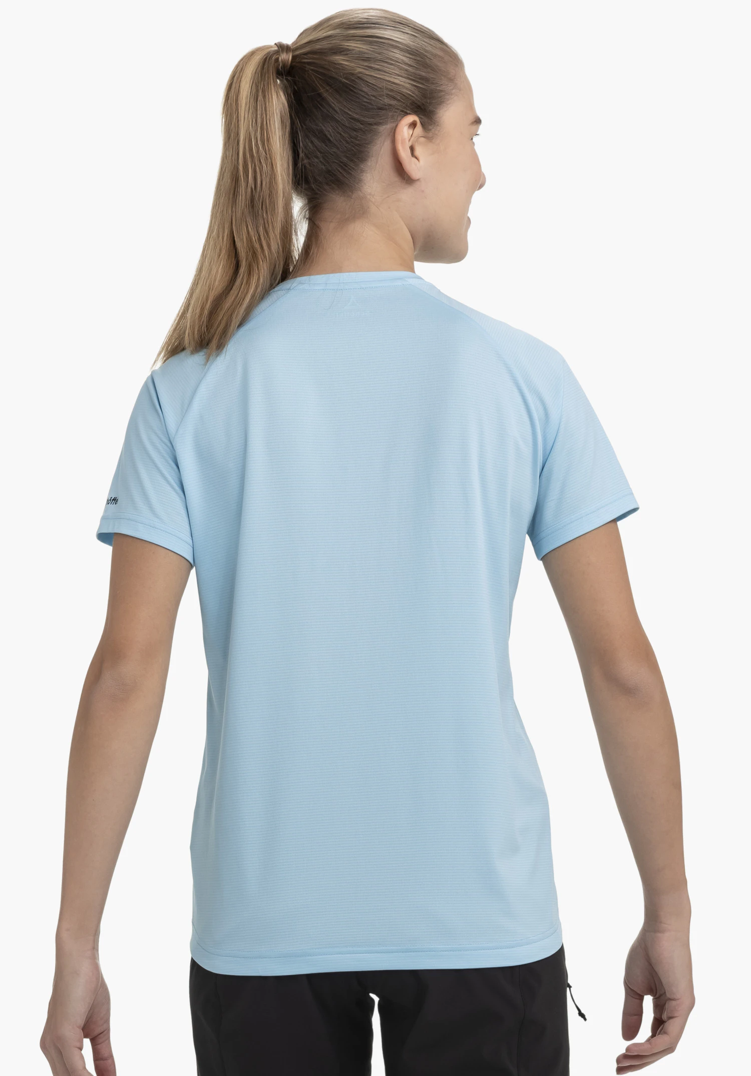 CIRC Shirt Style Wetluga WMS in blue. The model is shown from behind against a neutral background. The subtle Schöffel logo is visible on the sleeve.