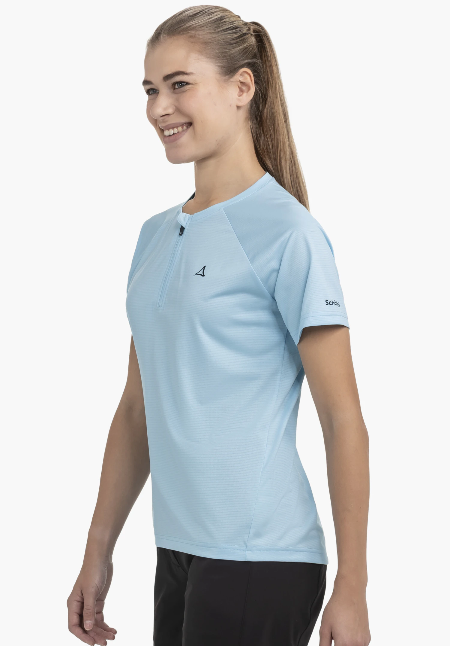 CIRC Shirt Style Wetluga WMS in blue, showcased against a neutral background. The model is standing in a side profile, highlighting the shirt's short zip and the subtle Schöffel logo on the sleeve.