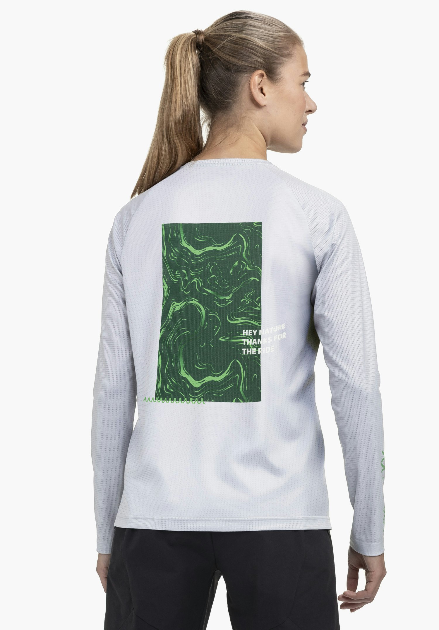 Longsleeve Style Koitere WMN in grey shown from the back against a neutral background. The model highlights the striking green back print design of the longsleeve, with the subtle Schöffel logo visible on the sleeve.