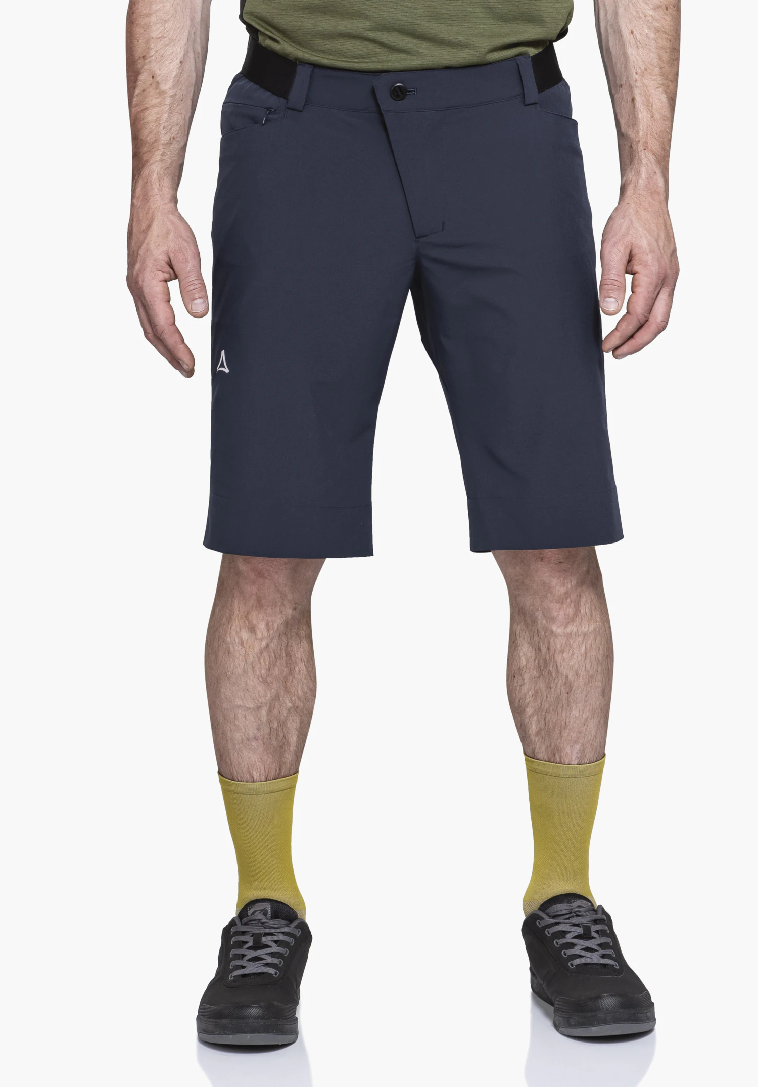 Shorts Style Keitele MNS worn by a model standing in a frontal pose. The blue shorts with the visible Schöffel logo on the right leg are shown against a neutral background.