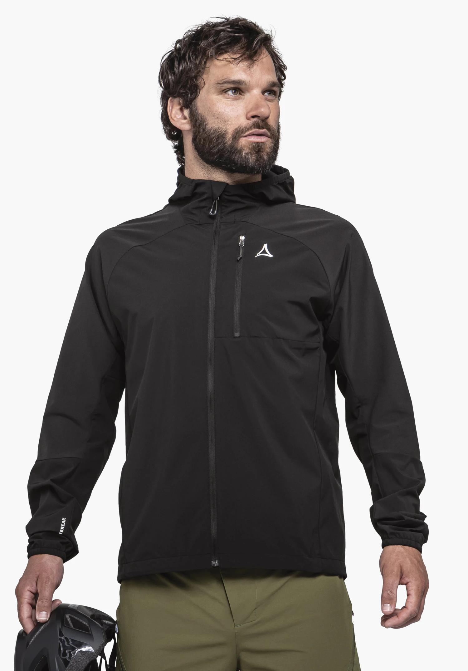 Hybrid Jk Style Mamry MNS in black on a model. The model stands frontally, wearing the jacket with a visible Schöffel-Logo on the chest and holding a bicycle helmet, against a neutral background.