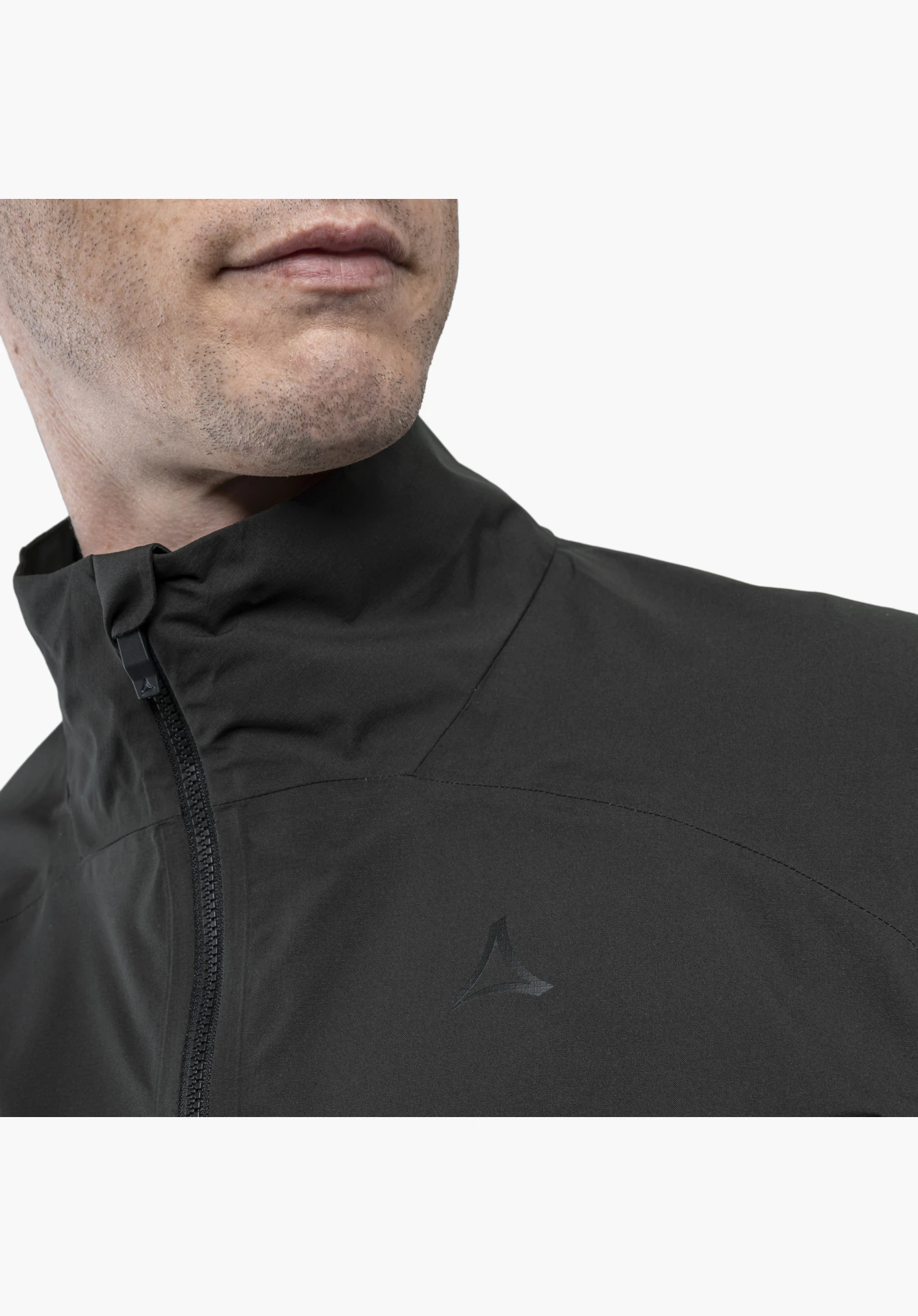 Jacket Style Lurbek MNS shows in detail the black collar, the zip, and the tonal Schöffel logo on the chest, close-up in front of a white/neutral background.