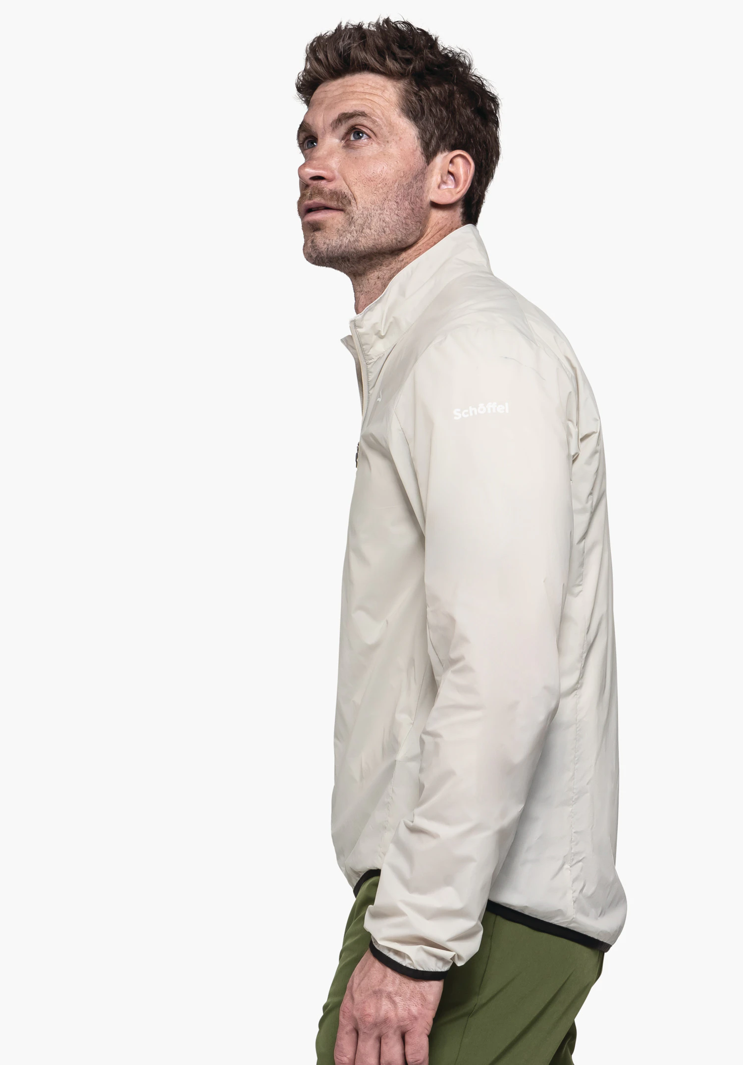 Jacket Style Cannobio MNS in the color nature. A model shows the jacket in a side view against a neutral background. The subtle Schöffel logo is clearly visible on the shoulder area.