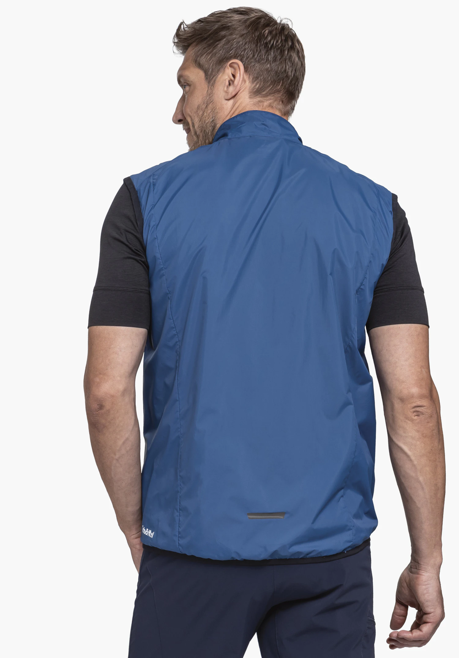 Vest Style Cannobio MNS in blue in a rear view against a neutral background, with the Schöffel logo visible on the hem.