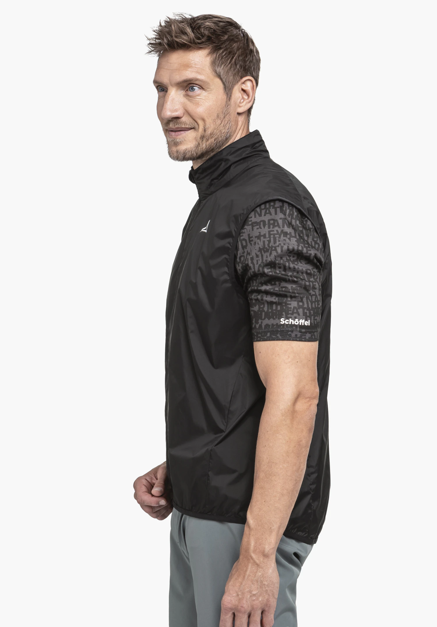 Vest Style Cannobio MNS in black, worn by a model in a side profile view against a neutral background; the Schöffel logo is clearly visible on the chest.