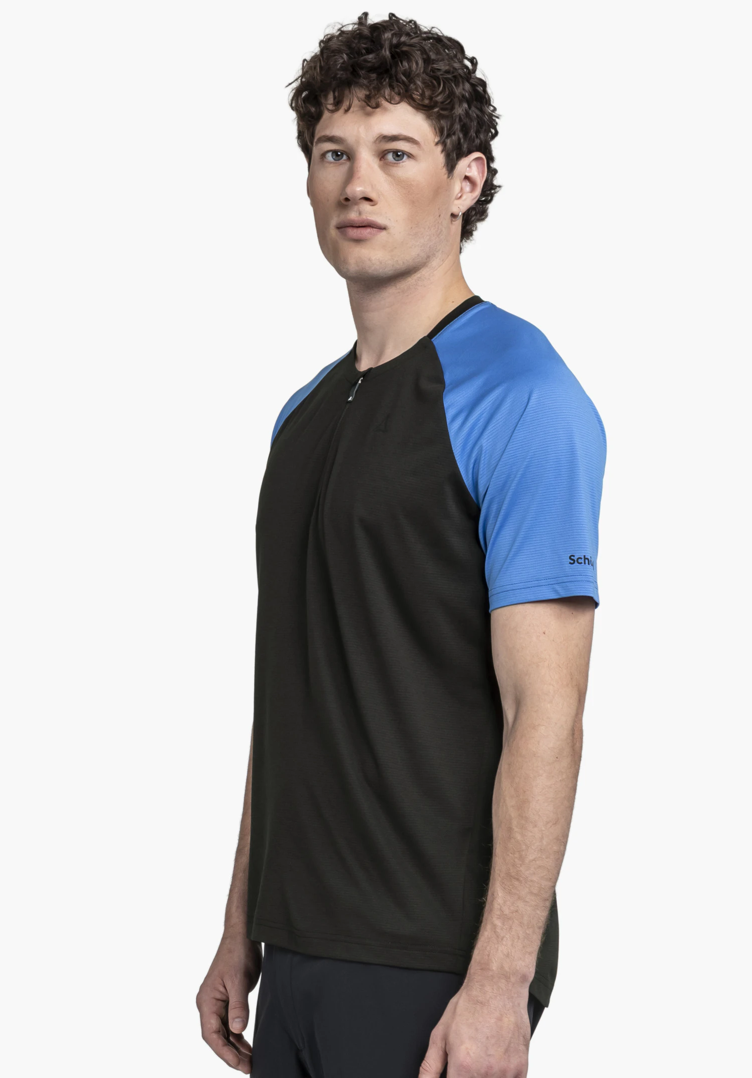 CIRC Shirt Style Wetluga MNS worn by a model in a side view in the colour black with the Schöffel logo visible on the sleeve against a neutral background.