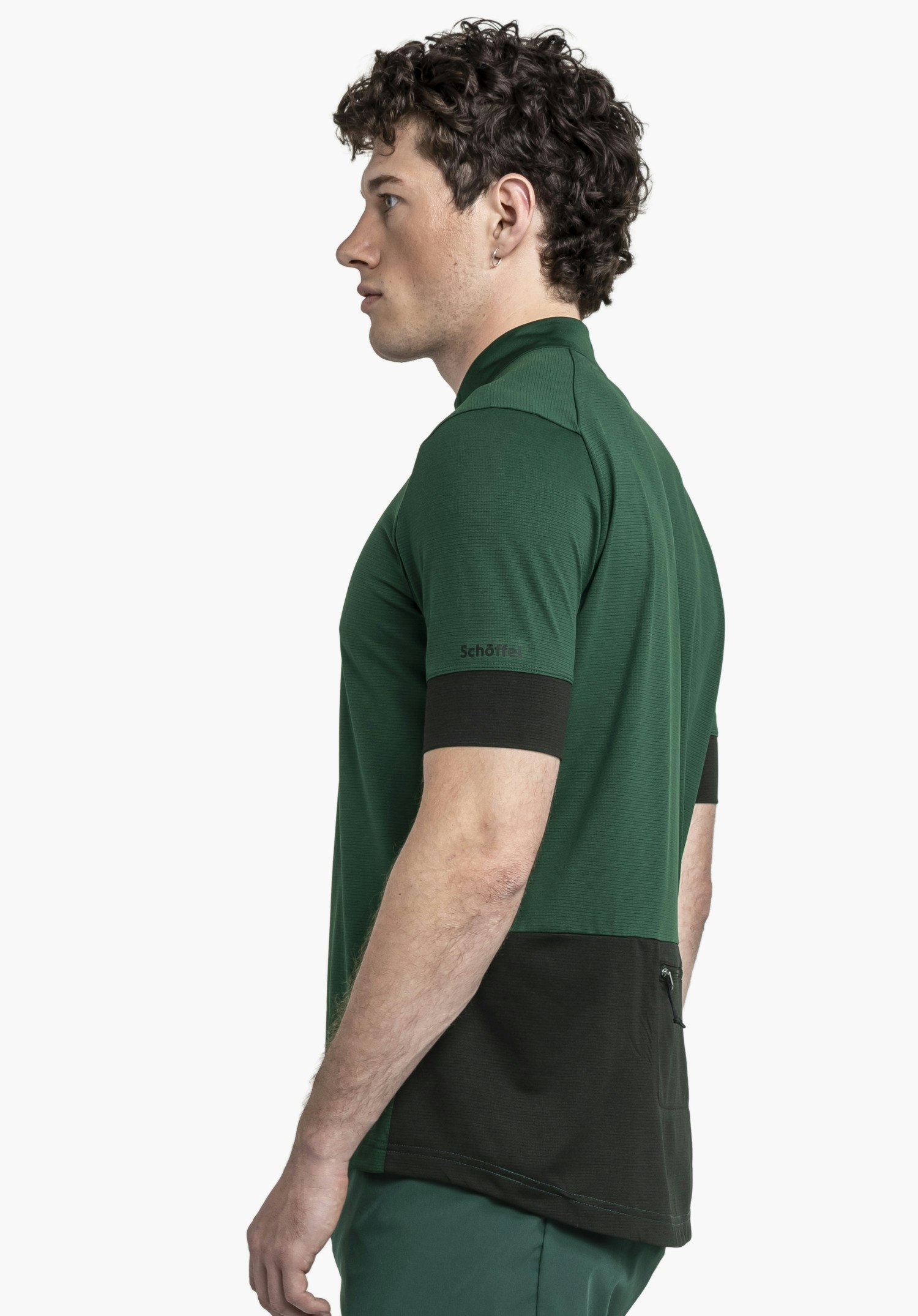 CIRC Shirt Style Pinega MNS in a side view on a model against a neutral background, showing the Schöffel logo on the sleeve in green.