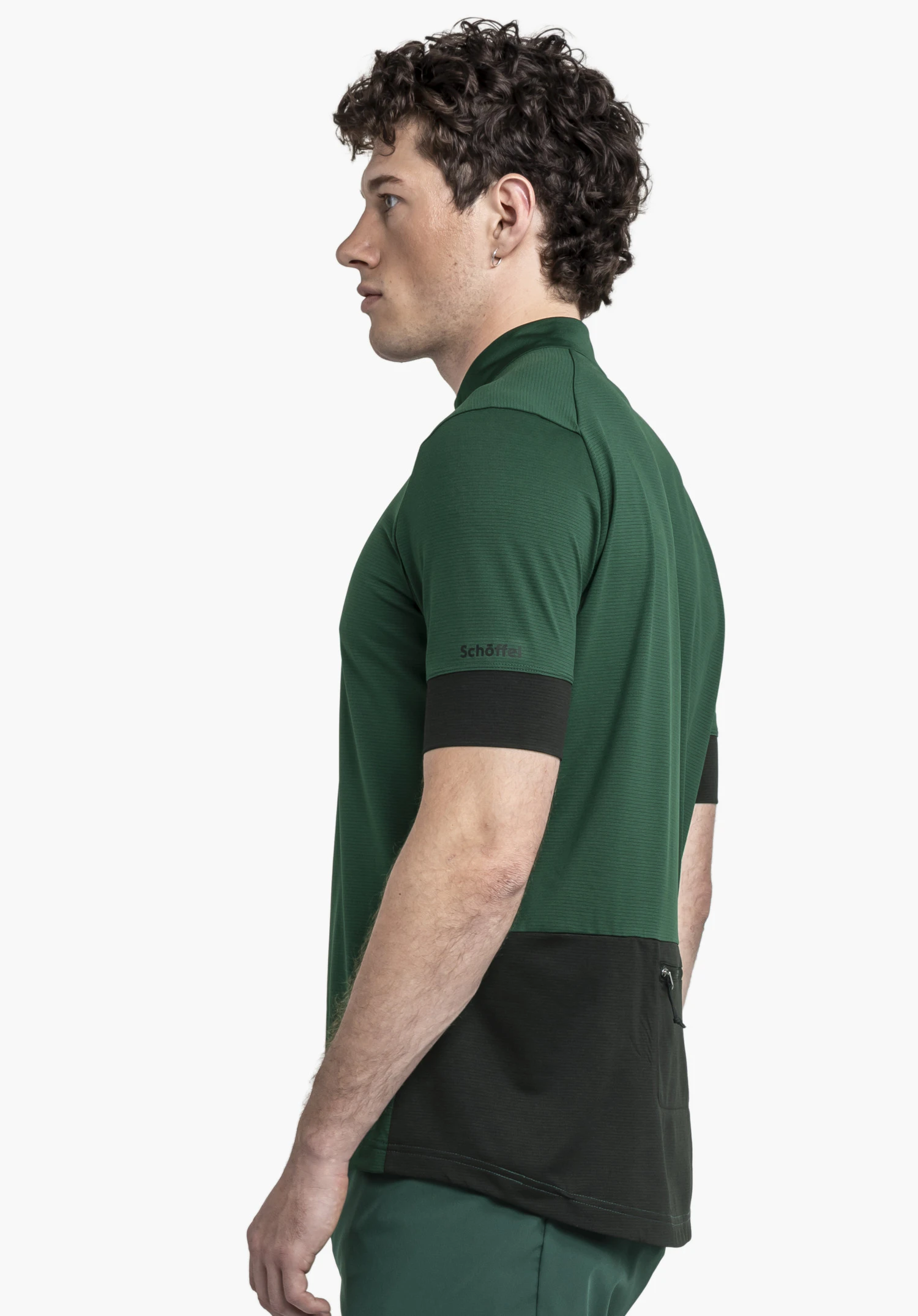 CIRC Shirt Style Pinega MNS in a side view on a model against a neutral background, showing the Schöffel logo on the sleeve in green.