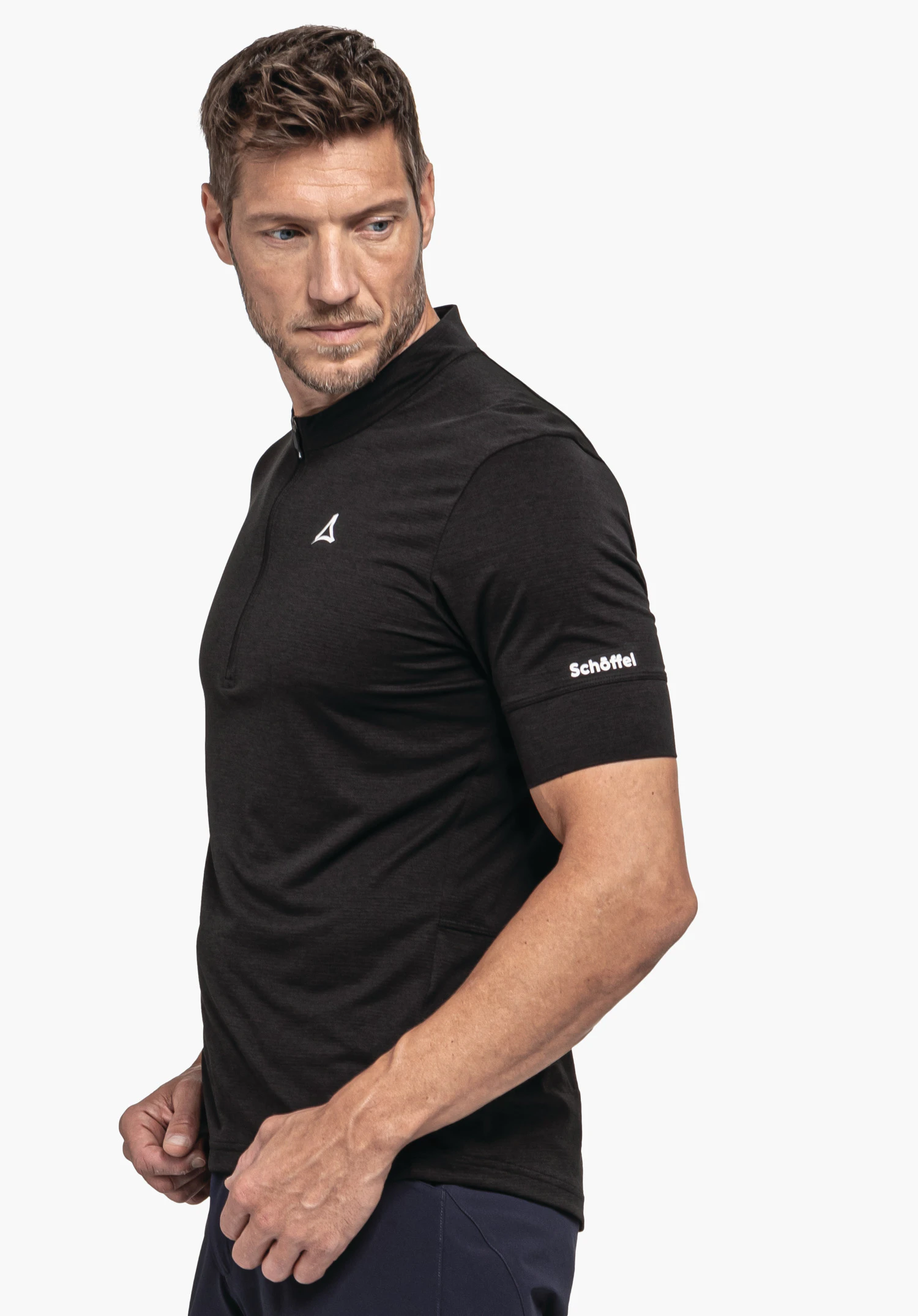 CIRC Shirt Style Pinega MNS features a model in a side profile pose wearing the black shirt against a neutral background; the Schöffel logo is visible on the chest and the sleeve.