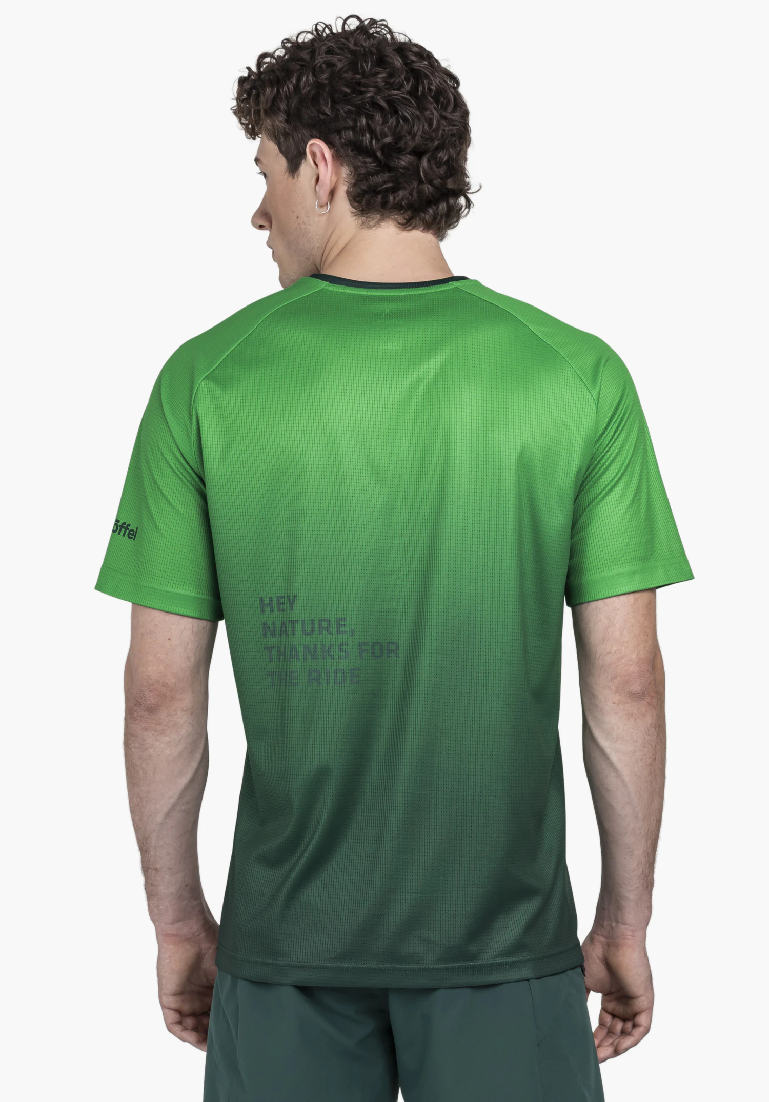 Shirt Style Koitere MEN is shown from the back against a neutral background. The model wears the shirt in green, featuring a subtle Schöffel logo on the sleeve.