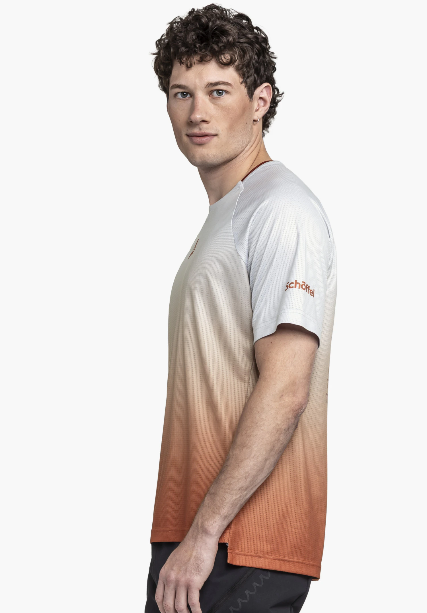 Shirt Style Koitere MEN, a male model wearing the shirt in red with a colour gradient, standing sideways against a neutral background; the Schöffel logo is visible on the sleeve.