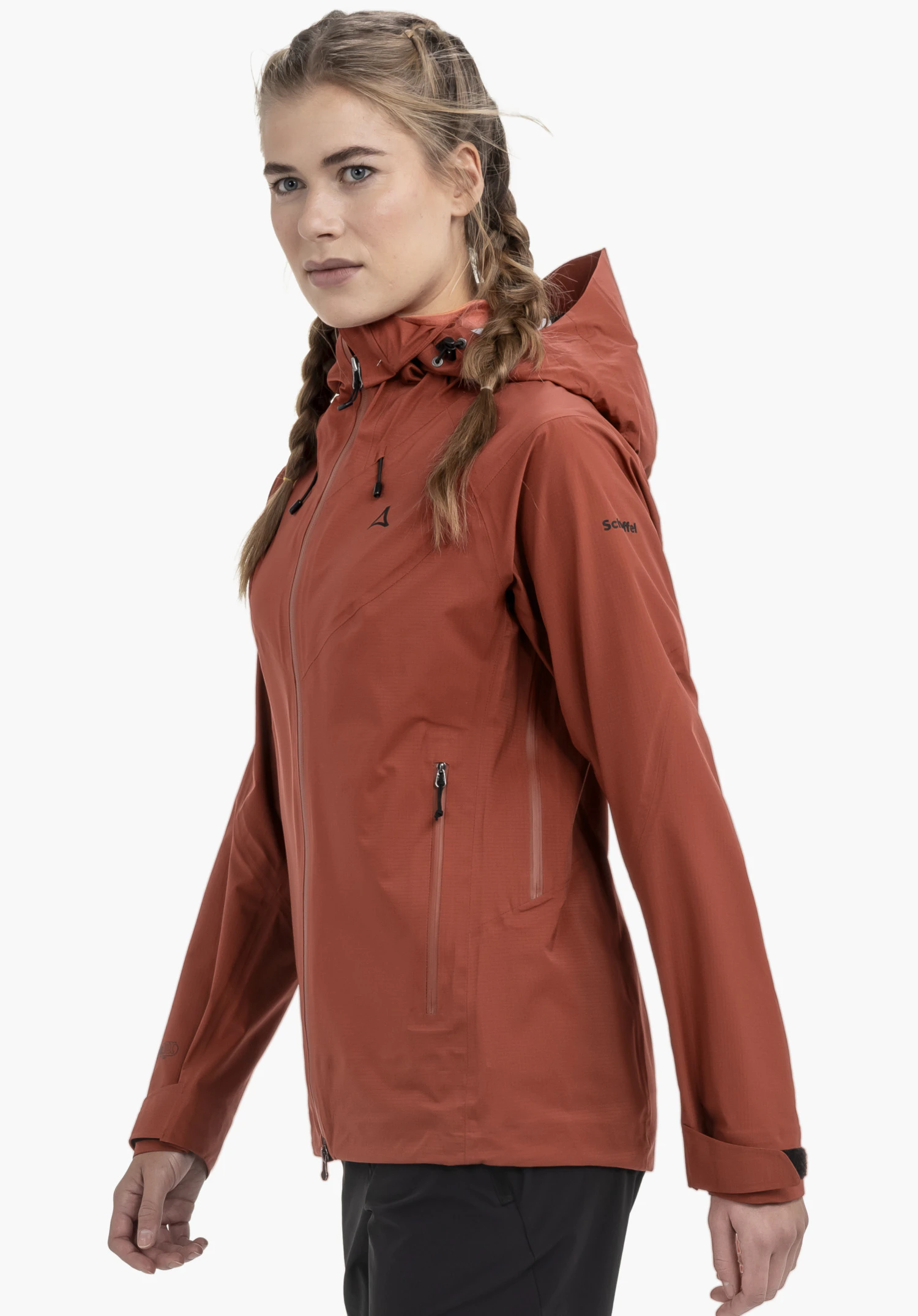 Jacket Style Blaueis WMS in red. A model stands sideways, presenting the closed jacket with a visible Schöffel logo on the chest and sleeve against a neutral background.