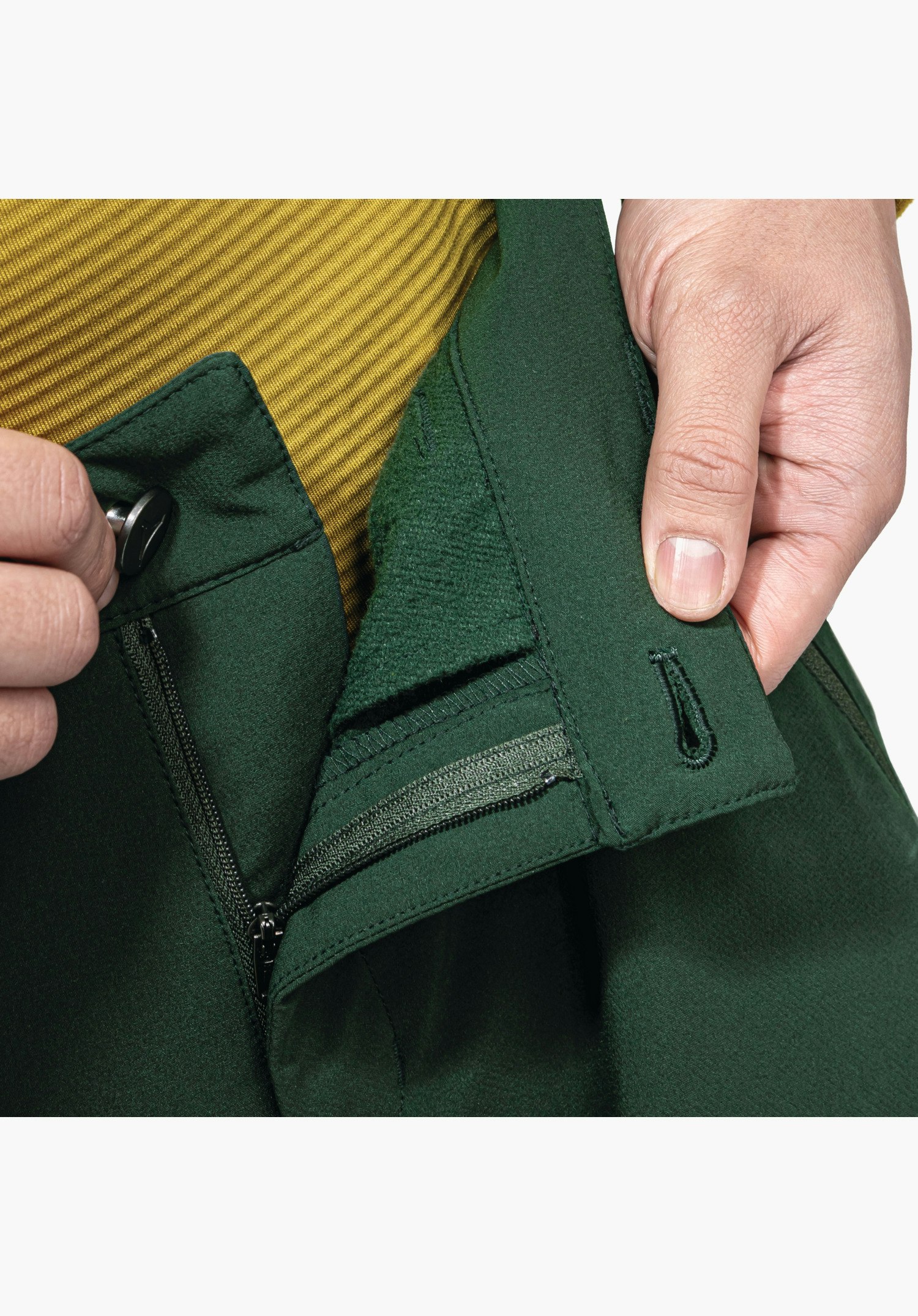 Pants Style Cascata MNS. Detail view of the green waistband with button and zip, showing the soft inner lining. Close-up against a white/neutral background.