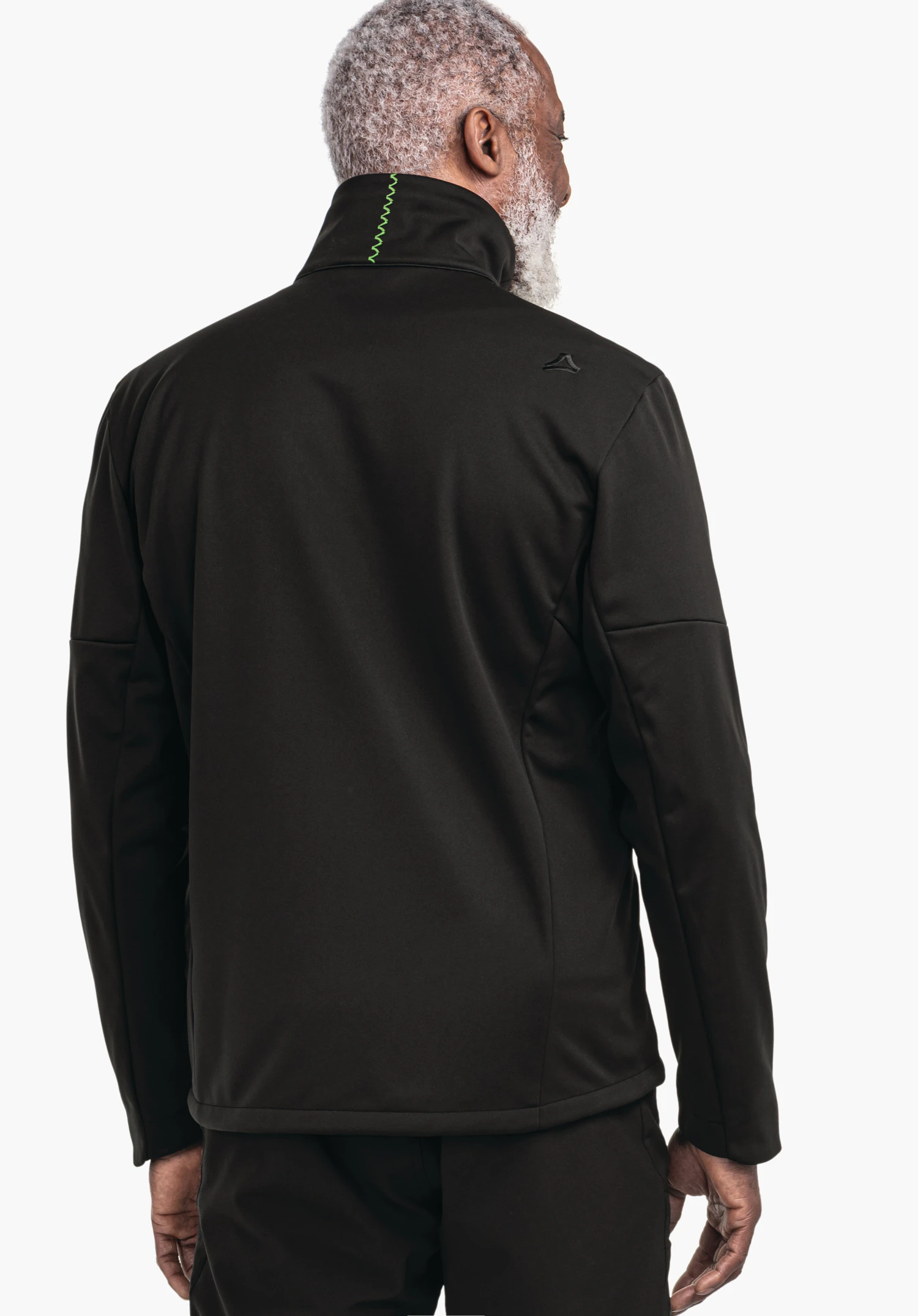 Softshell Jk Style Fracon MNS black jacket worn by a man standing with his back to the camera; Schöffel logo on the right shoulder, green decorative stitching at the collar; white background., Softshell Jk Style Fracon MNS black jacket worn by a man standing with his back to the camera; Schöffel logo on the right shoulder, green decorative stitching at the collar; white background.