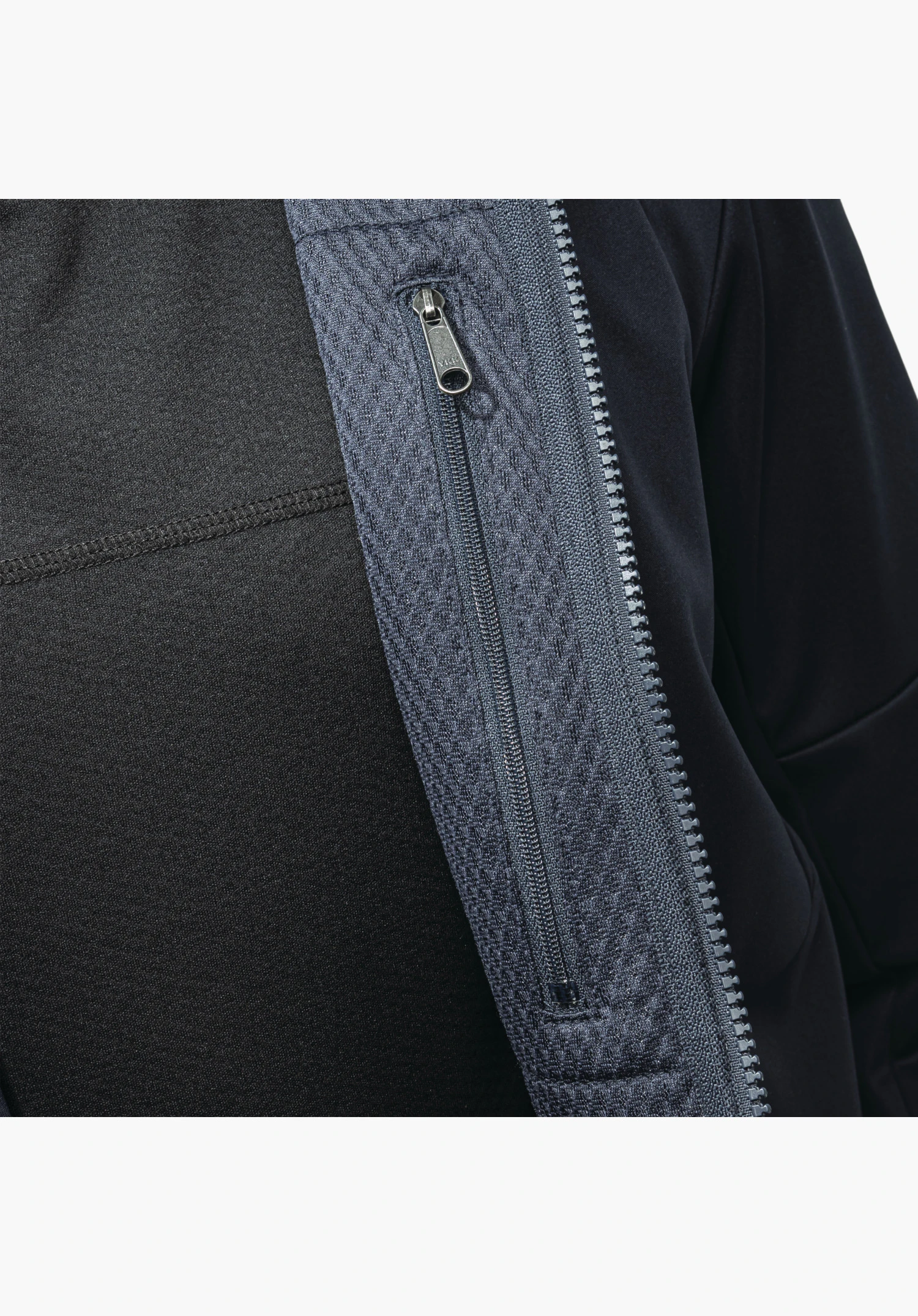 Softshell Jk Style Fracon MNS shows the vertical zip set into a textured blue fabric panel, close-up shot against a white/neutral background., Softshell Jk Style Fracon MNS shows the vertical zip set into a textured blue fabric panel, close-up shot against a white/neutral background.