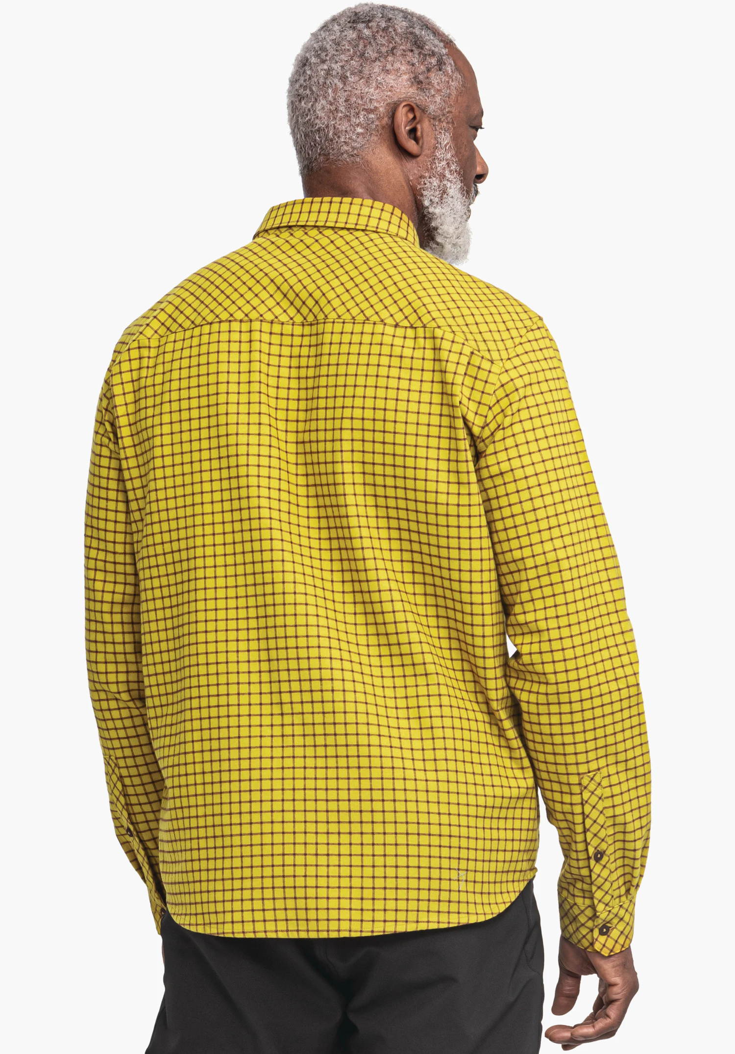 Shirt Style Boyoma MNS Hellgelbes Hemd mit schwarzen Karos bedeckt den Rücken einer stehenden, seitlich blickenden Person; Ärmel reichen knapp zu den Händen, vor gleichmäßig hellem Hintergrund.