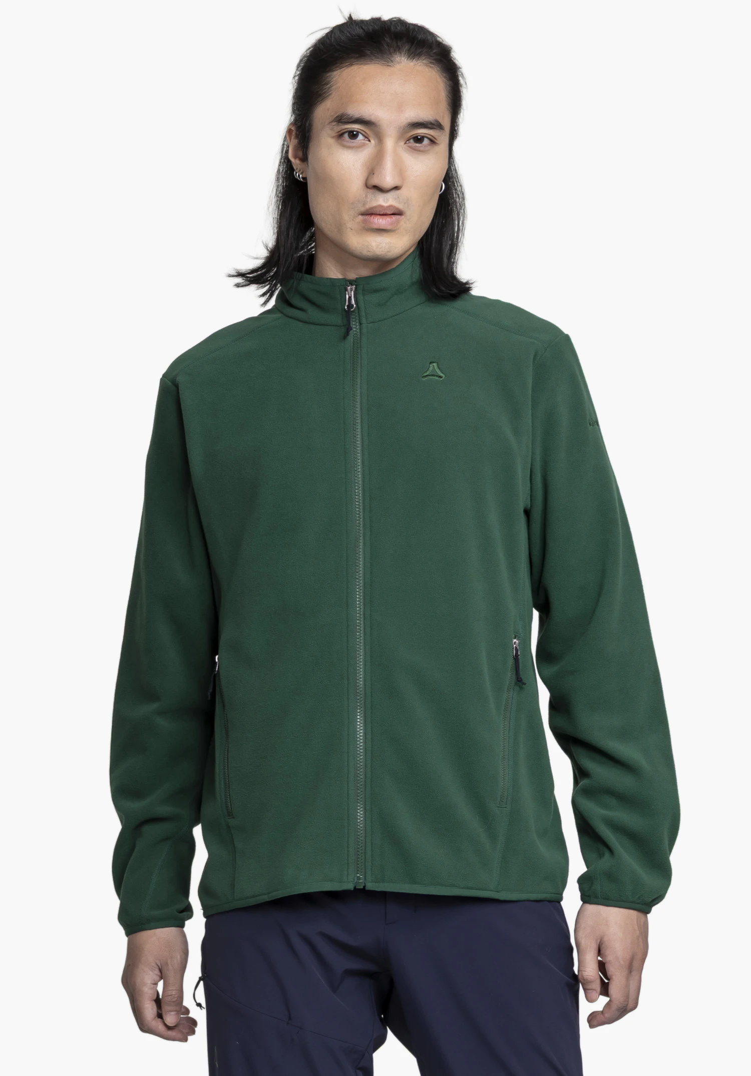 Fleece Jk Style Ash MNS. Un mannequin se tient de face et porte la veste en polaire verte avec le logo Schöffel visible sur la poitrine gauche, devant un fond neutre.