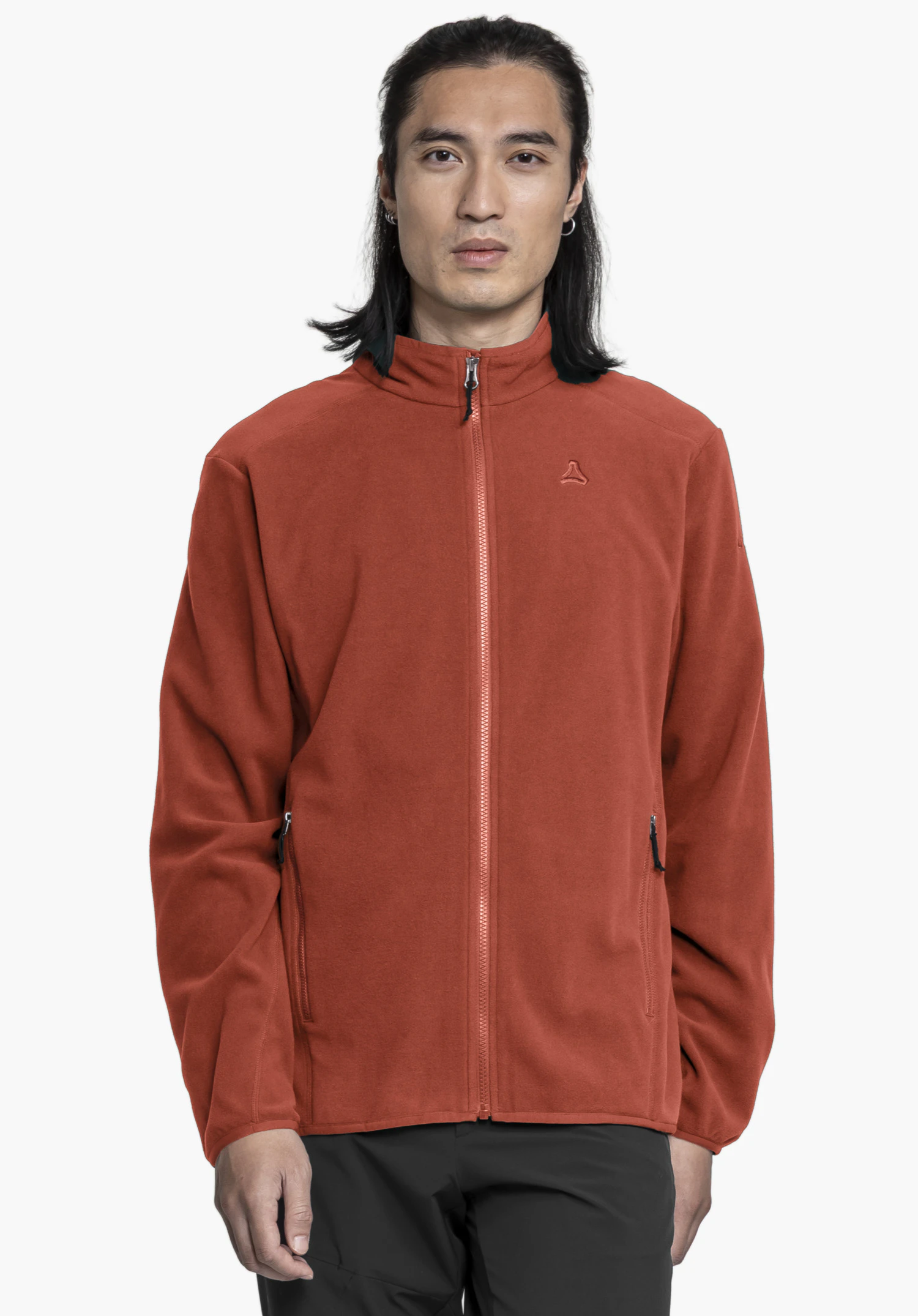 Fleece Jk Style Ash MNS worn by a model standing facing forward against a neutral background. The model is wearing the red fleece jacket fully zipped up. The Schöffel logo is visible on the left chest.