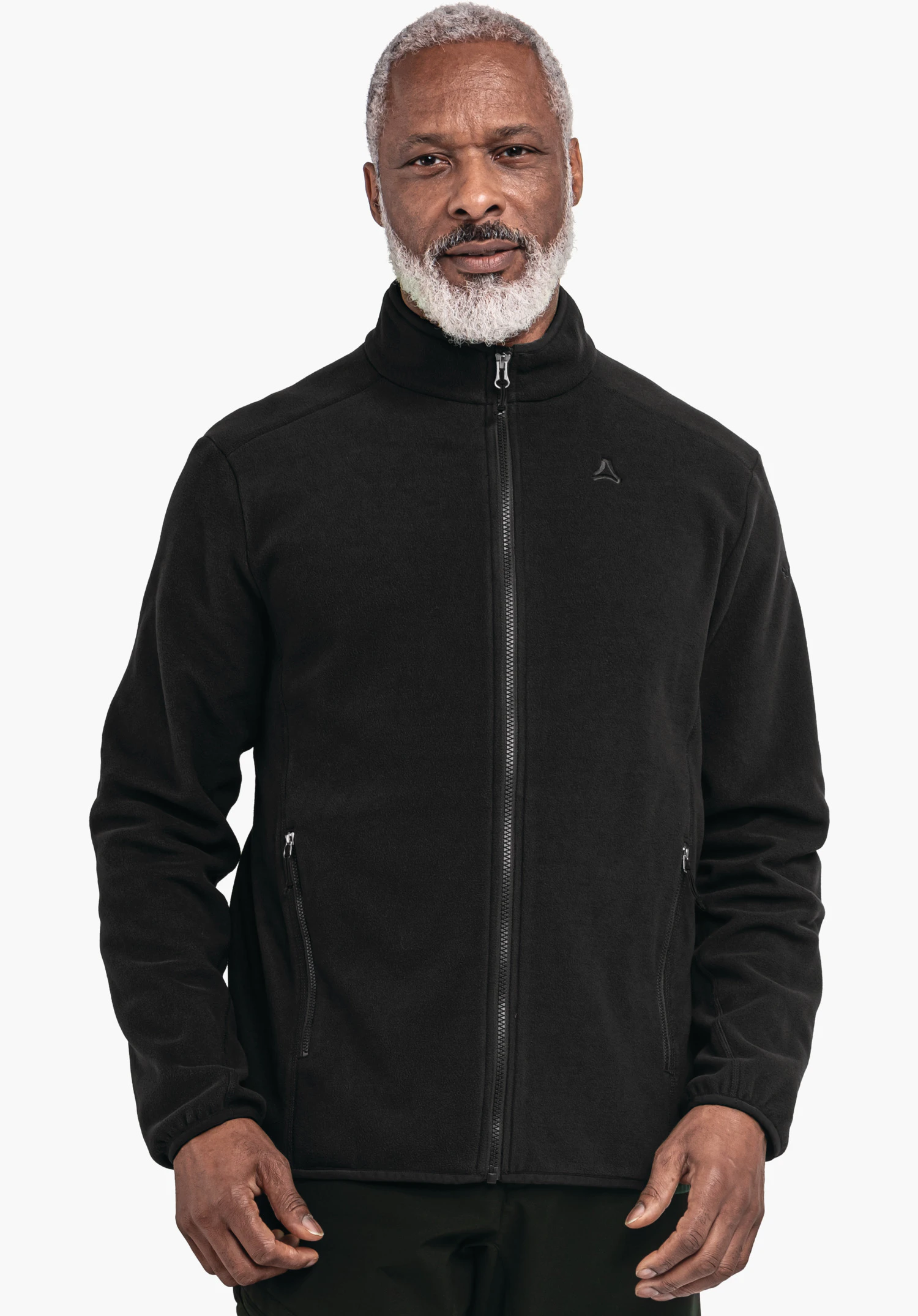 Fleece Jk Style Ash MNS black fleece jacket, worn by a standing man with white hair and beard; Schöffel logo on the chest; white background., Fleece Jk Style Ash MNS black fleece jacket, worn by a standing man with white hair and beard; Schöffel logo on the chest; white background.